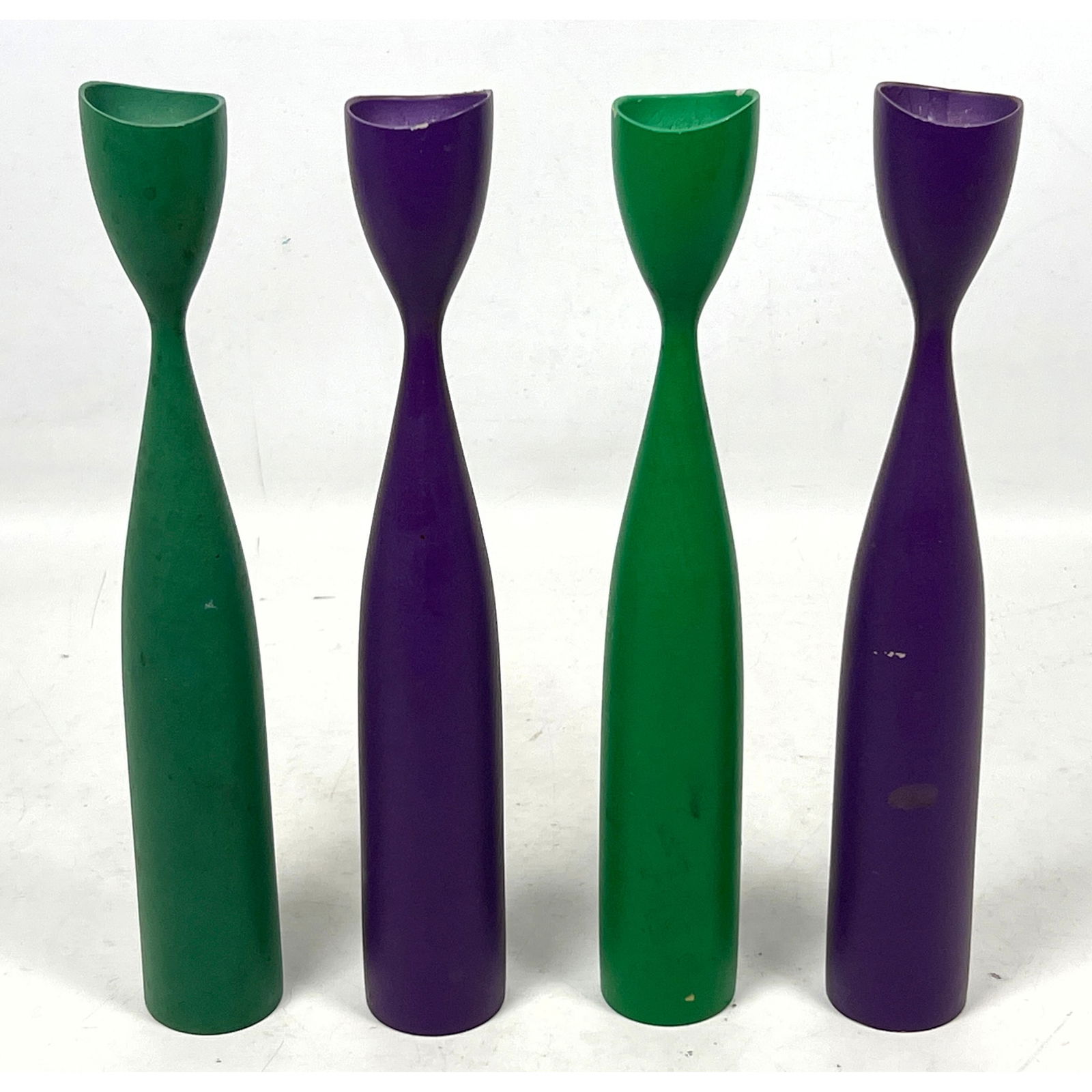 Set 4 Mid-Century Modern candlestick holders featuring a minimalist, tapered spindle-form design. Wi: Set 4 Mid-Century Modern candlestick holders featuring a minimalist, tapered spindle-form design. Wirkkala style. Dimensions: Height: 12 inches, Width: 1.5 inches, Depth: 1.5 inches. --- US Packing an