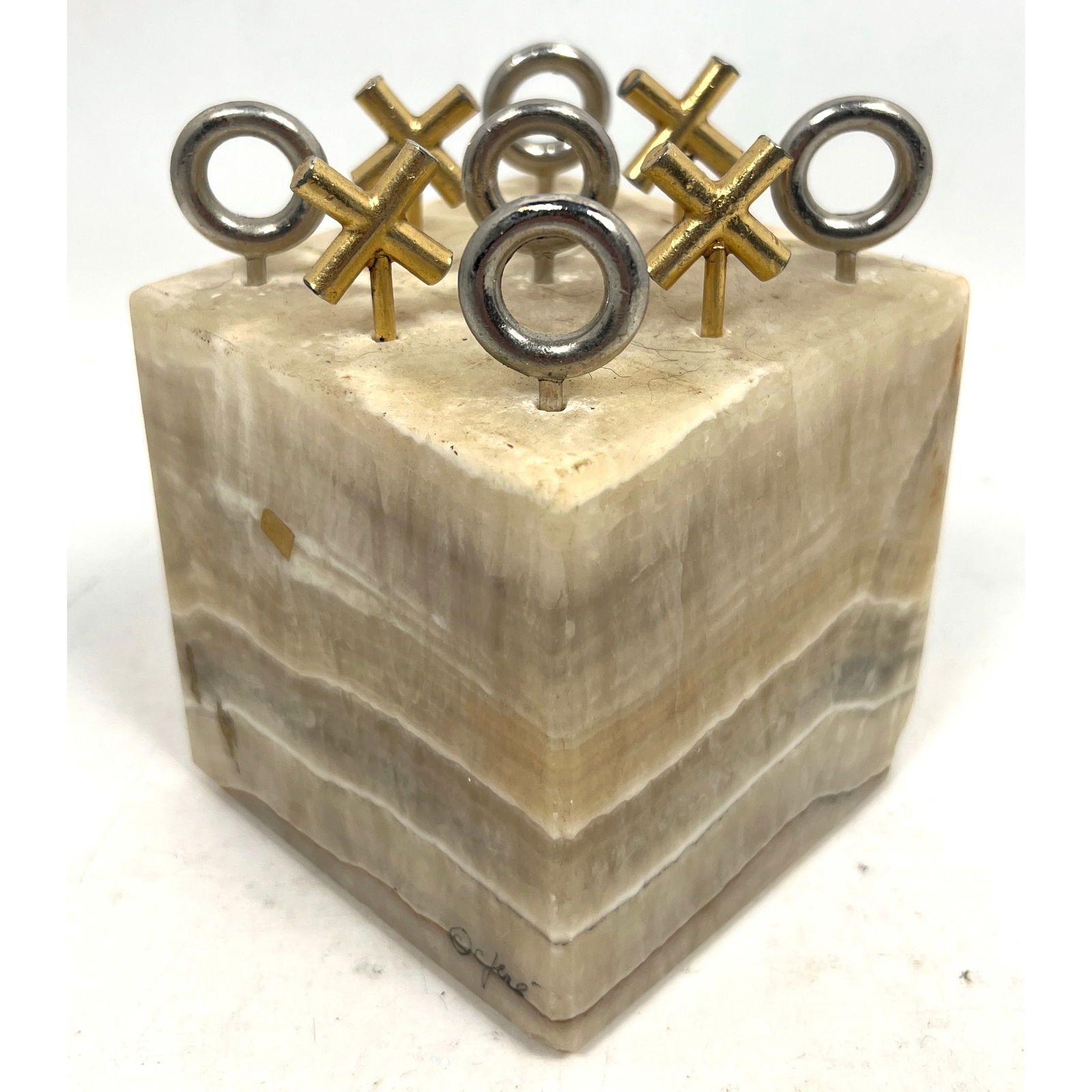 C JERE Tic Tac Toe Game. Solid Onyx Cube Block signed c. C Jere. Chrome and Gold Tone Game Pieces. M: C JERE Tic Tac Toe Game. Solid Onyx Cube Block signed c. C Jere. Chrome and Gold Tone Game Pieces. Mid Century Design. Dimensions: Height: 5.5 inches, Width: 4 inches, Depth: 4 inches. --- 