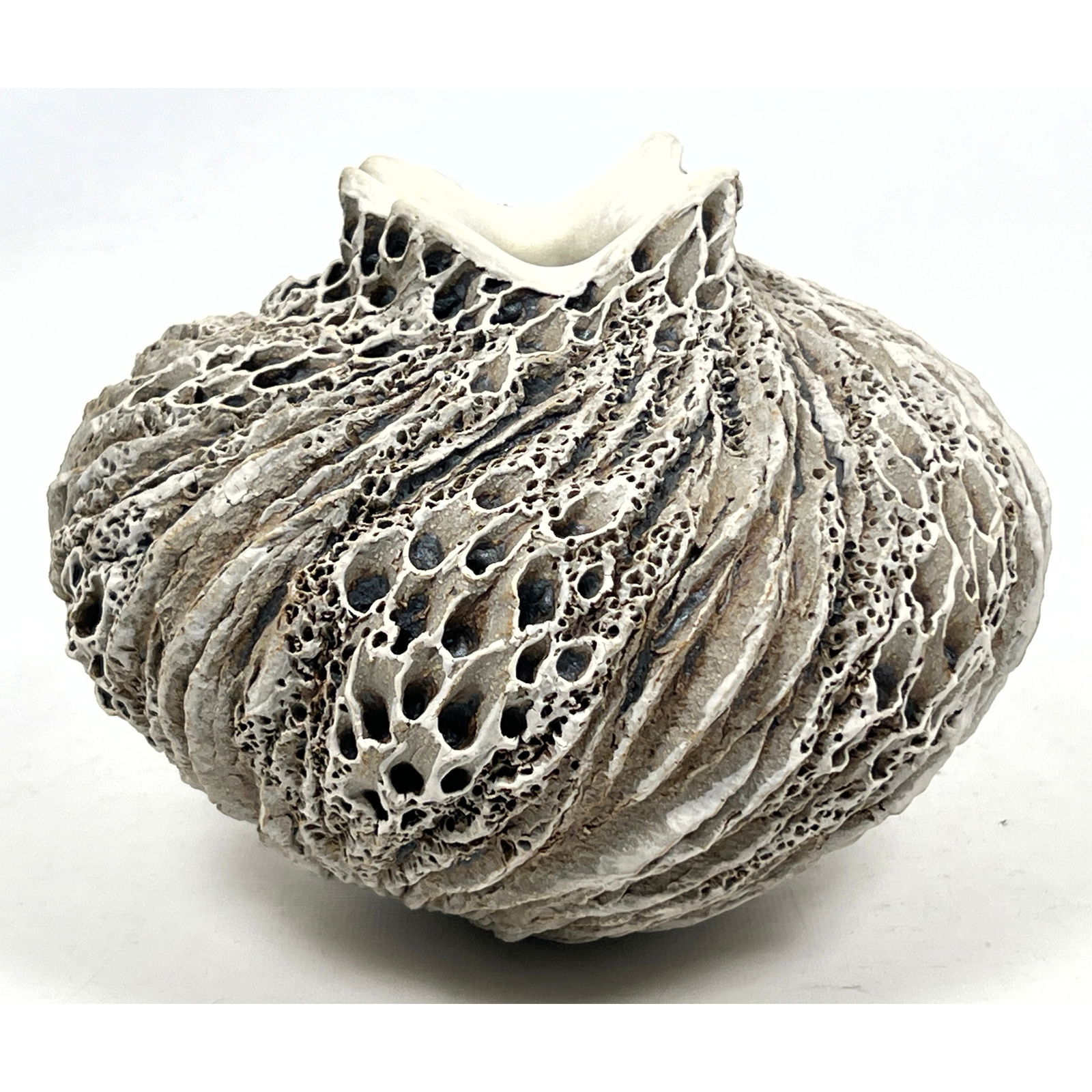 ANNE GOODMAN Art Pottery Vessel. "Coastal Rock" Stoneware Vessel. Hand carved with textured, pierced: ANNE GOODMAN Art Pottery Vessel. "Coastal Rock" Stoneware Vessel. Hand carved with textured, pierced surfaces. Dimensions: Height: 5.5 inches, Width: 8 inches, Depth: 8 inches. --- US Packing and Ship