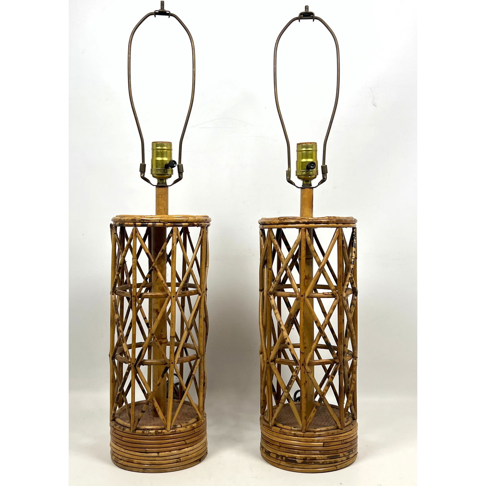 Pr Woven Basket weave Bamboo Table Lamps. Tall Column Forms with Pencil Reed Trim.: Pr Woven Basket weave Bamboo Table Lamps. Tall Column Forms with Pencil Reed Trim. Dimensions: Height: 27.5 inches, Width: 6.25 inches, Depth: 6.25 inches. --- US Packing and Shipping charge: In house
