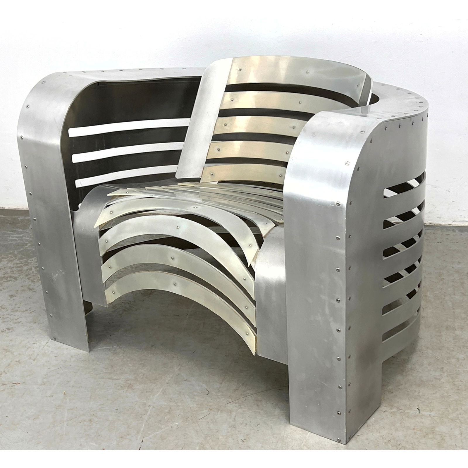 Artisan Aluminum Deco Airstream Style Lounge Chair. Handmade with open slat design. Rubberized strip: Artisan Aluminum Deco Airstream Style Lounge Chair. Handmade with open slat design. Rubberized strips for cushioning. Monumental sculptural lounge chair fabricated from brushed aluminum with exposed