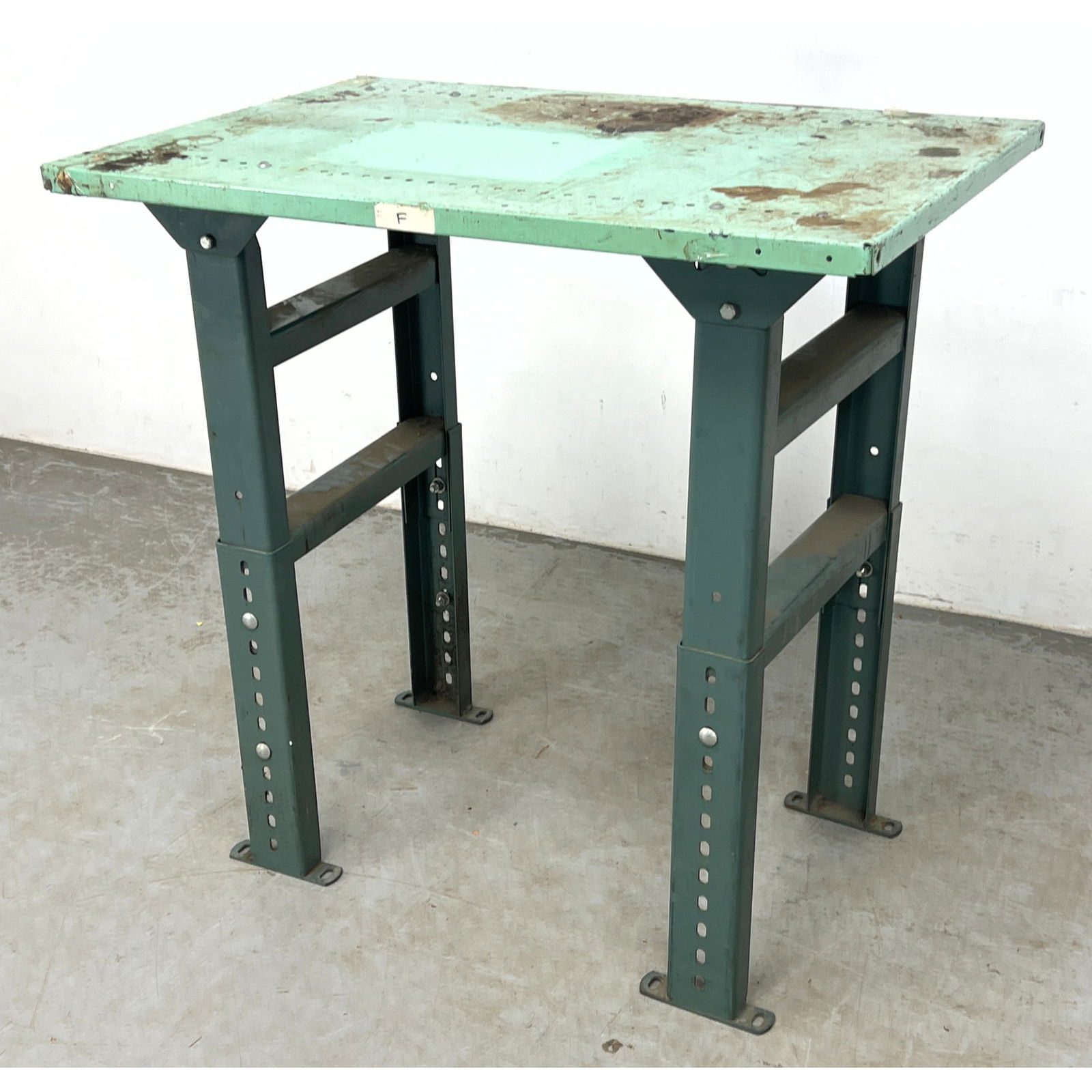 Industrial Steel Workbench, Green Worn Finish, Adjustable Height.: Industrial Steel Workbench, Green Worn Finish, Adjustable Height. Dimensions: Height: 35.25 inches, Width: 36 inches, Depth: 24 inches. ---