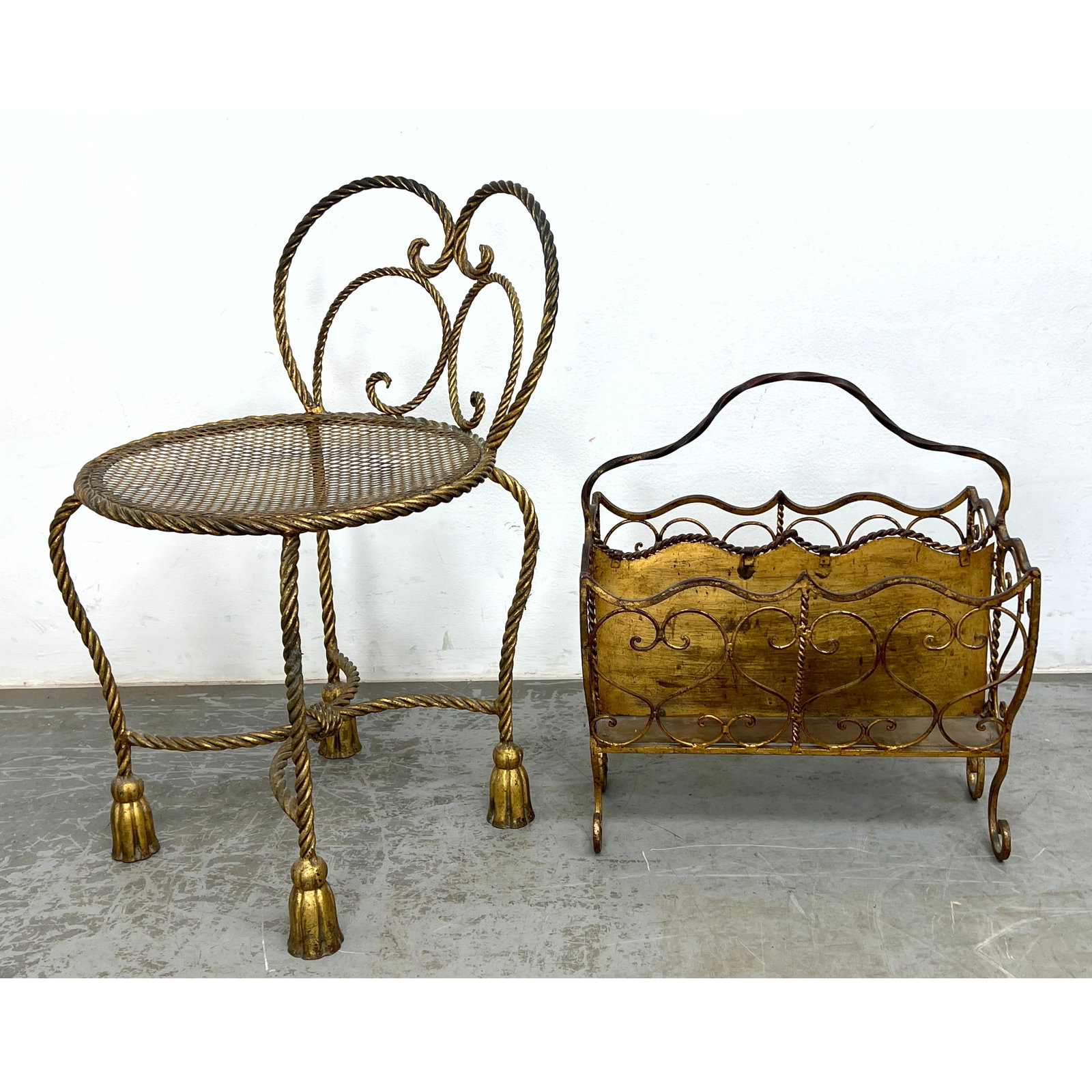 2pc Italian Gilt Iron. 1) Low Vanity Chair with Twisted Iron Legs and Tassel Feet. 2) Highly ornate: 2pc Italian Gilt Iron. 1) Low Vanity Chair with Twisted Iron Legs and Tassel Feet. 2) Highly ornate heart scroll Double sided magazine rack holder. Dimensions: Height: 26.5 inches, Width: 16 inches, D