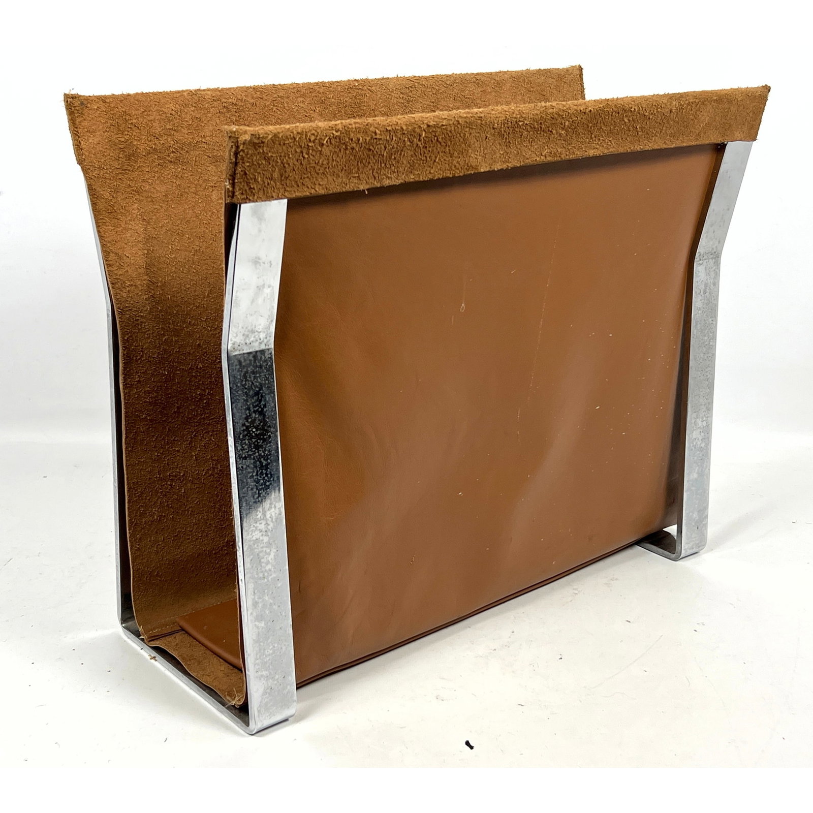 Milo Baughman style Flat Bar Chrome and Leather Magazine Rack.: Milo Baughman style Flat Bar Chrome and Leather Magazine Rack. Dimensions: Height: 15 inches, Width: 18 inches, Depth: 9 inches. ---