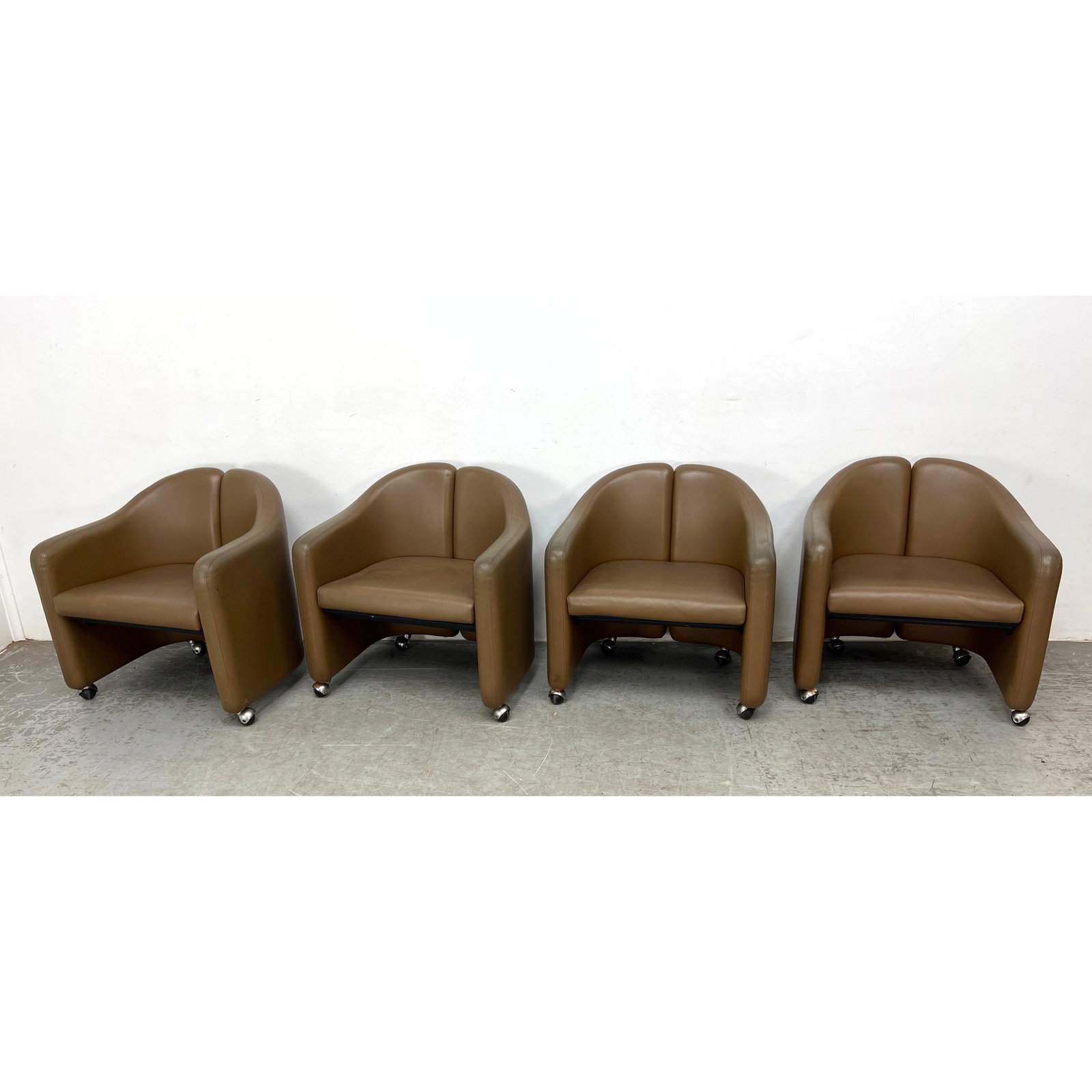 Set 4 Eugenio Gerli for Tecno. Split Barrel Back Chairs on Casters. PS 142: Set 4 Eugenio Gerli for Tecno. Split Barrel Back Chairs on Casters. PS 142 Dimensions: Height: 27 inches, Width: 26.5 inches, Depth: 24 inches. - Seat Height: 16 inches ---