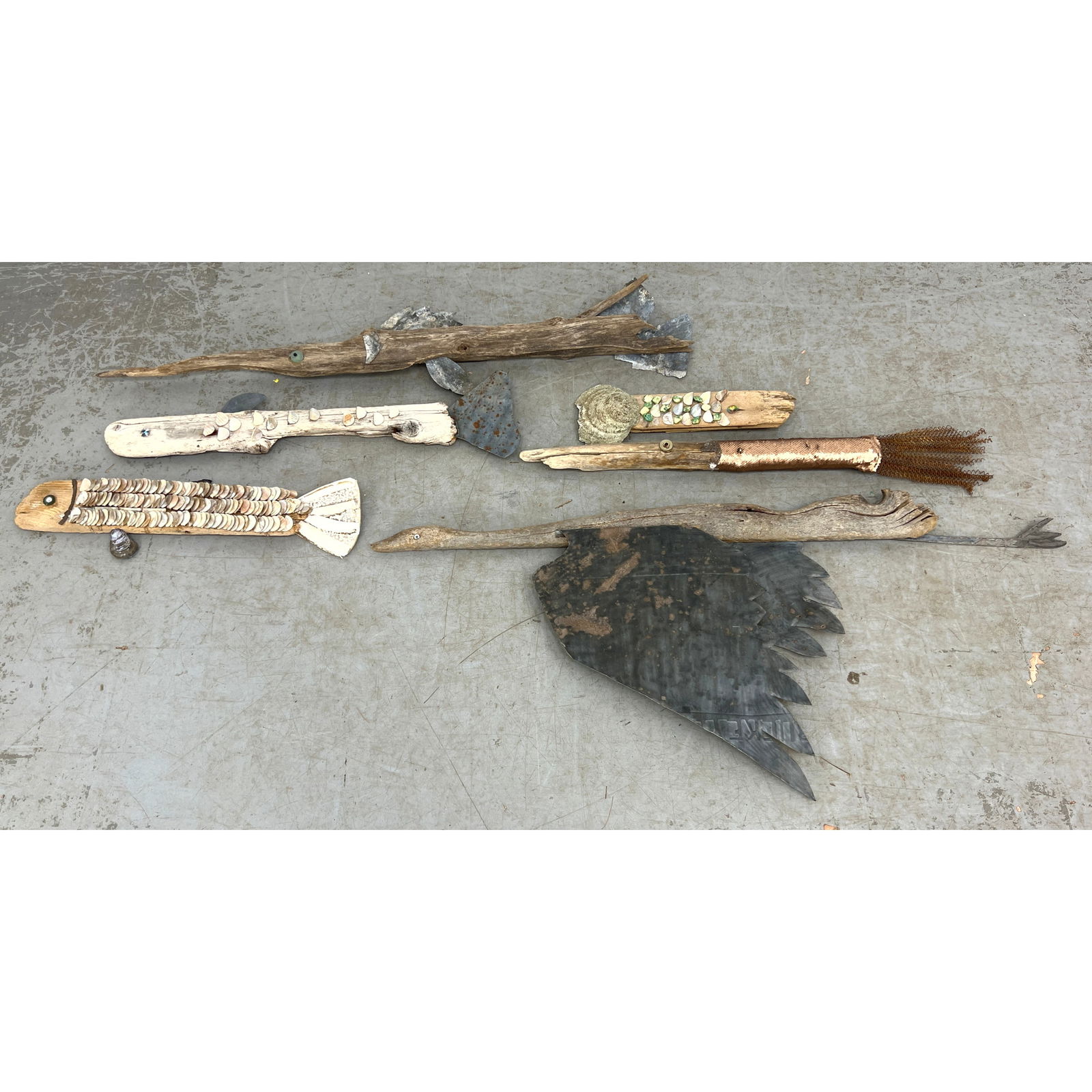 6pc Mixed Media Found Object Fish and Bird Sculptures. Found Wood provides base for figural sculptur: 6pc Mixed Media Found Object Fish and Bird Sculptures. Found Wood provides base for figural sculptures decorated with shells, pebbles, metal, etc. Dimensions: Height: 22 inches, Width: 40.5