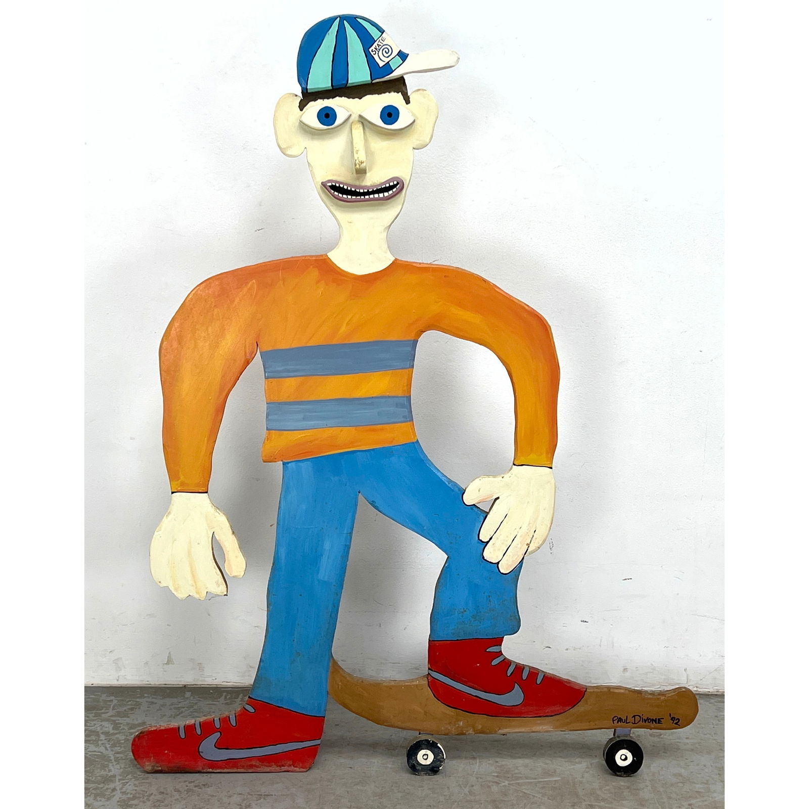 Paul DiVone Hand-painted standing wooden cutout sculpture, dated 1992. Purchased from the artist: Paul DiVone Hand-painted standing wooden cutout sculpture, dated 1992. Purchased from the artist Dimensions: Height: 49 inches, Width: 38 inches, Depth: 7 inches. ---