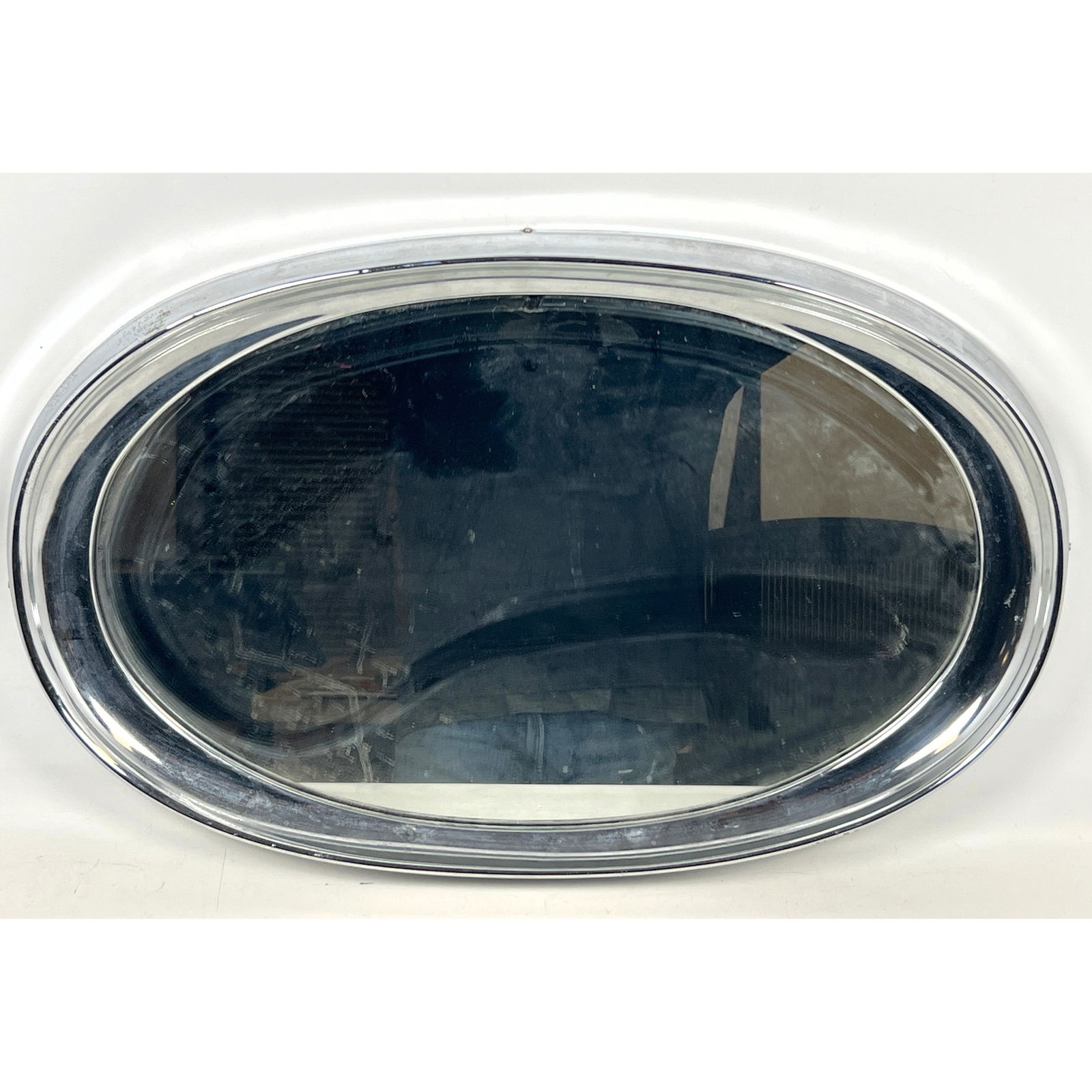 Chrome Framed Oval Modernist Wall Mirror. Can be hung vertically or horizontally.: Chrome Framed Oval Modernist Wall Mirror. Can be hung vertically or horizontally. Dimensions: Height: 28 inches, Width: 17 inches, Depth: 2 inches. --- US Packing and Shipping charge: In