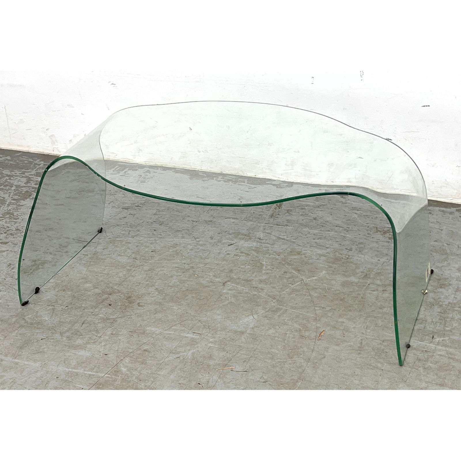 Danielle Quarante Ondine Coffee table. Shaped glass.: Danielle Quarante Ondine Coffee table. Shaped glass. Dimensions: Height: 12.5 inches, Width: 28.5 inches, Depth: 21.5 inches. ---