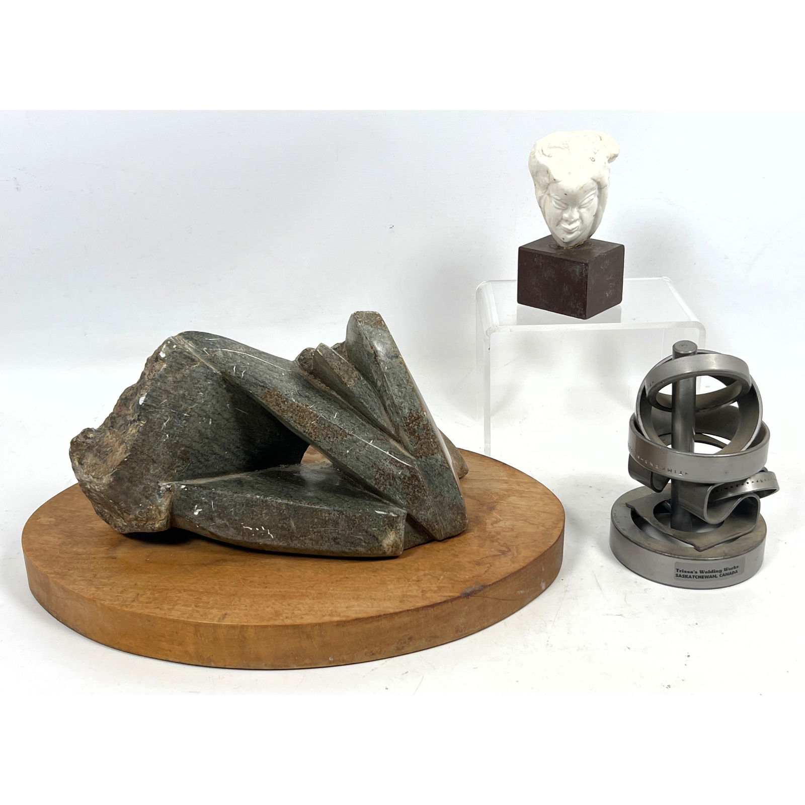 3pc Sculpture Lot. 1) TRISSA'S WELDING WORKS, Canada metal Sculpture. 2) HARRIET LAMP Carved Stone B: 3pc Sculpture Lot. 1) TRISSA'S WELDING WORKS, Canada metal Sculpture. 2) HARRIET LAMP Carved Stone Bust. Label. 3) Rough and Polished Stone Modern Sculpture. Dimensions: Height: 7 inches, Width: 13.5