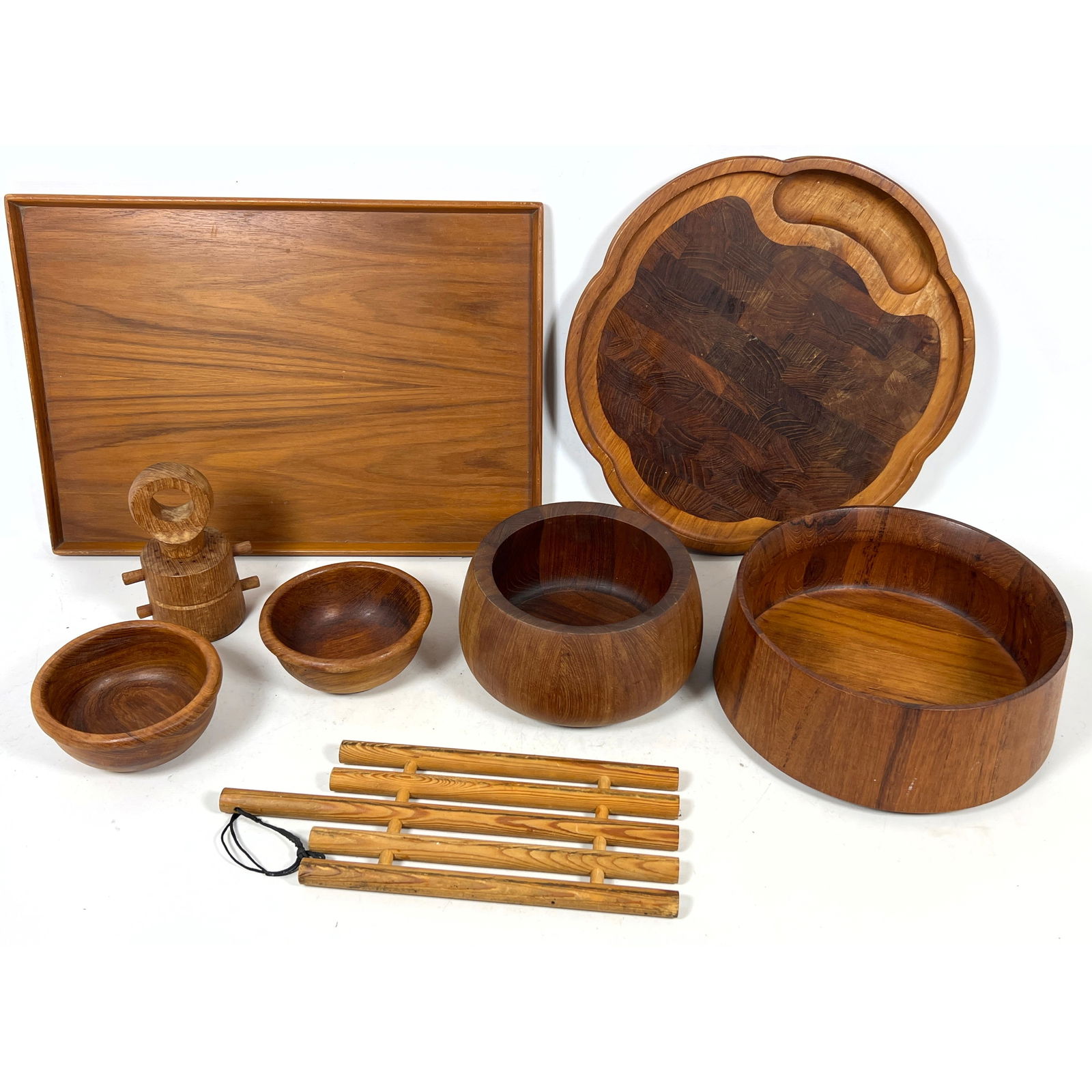8pcs Mid Century Modern Wood. Kipp Stuart for Drexel Declaration Walnut Tray, Dansk Peppermill, Dans: 8pcs Mid Century Modern Wood. Kipp Stuart for Drexel Declaration Walnut Tray, Dansk Peppermill, Dansk Tray, Two Dansk Teak Bowls, Kaija Aairikka Pine Trivet, and two Teak small Bowls Dimensions: Heigh