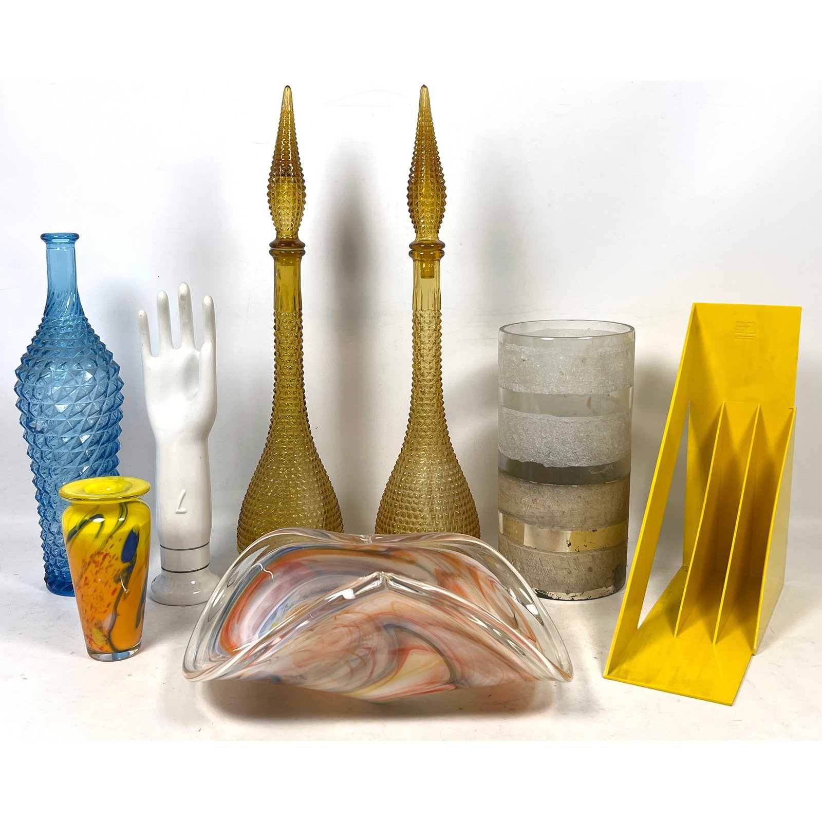 Assorted Shelf Lot. Glass and Porcelain. ROSENTHAL Porcelain Glove Mold. 2 Tall Amber Glass Stoppere: Assorted Shelf Lot. Glass and Porcelain. ROSENTHAL Porcelain Glove Mold. 2 Tall Amber Glass Stoppered Bottles. HELLER Record Storage. WHITE CRYSTAL Murano Bowl. more glass vases Dimensions: Height: 11