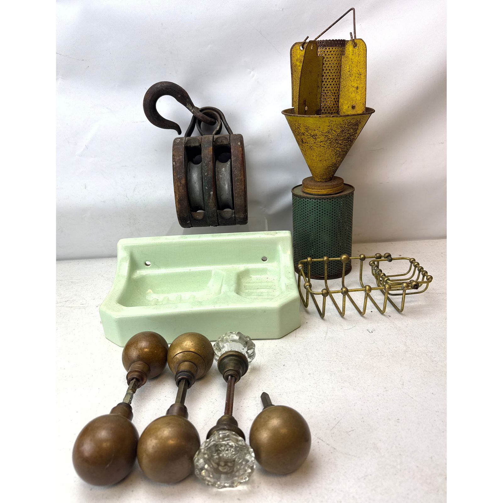 This assortment of architectural and industrial antiques includes a variety of domestic and mechanic: This assortment of architectural and industrial antiques includes a variety of domestic and mechanical components. Featured is a vintage metal beetle trap, attributed to Ellisco of Philadelphia, Penns