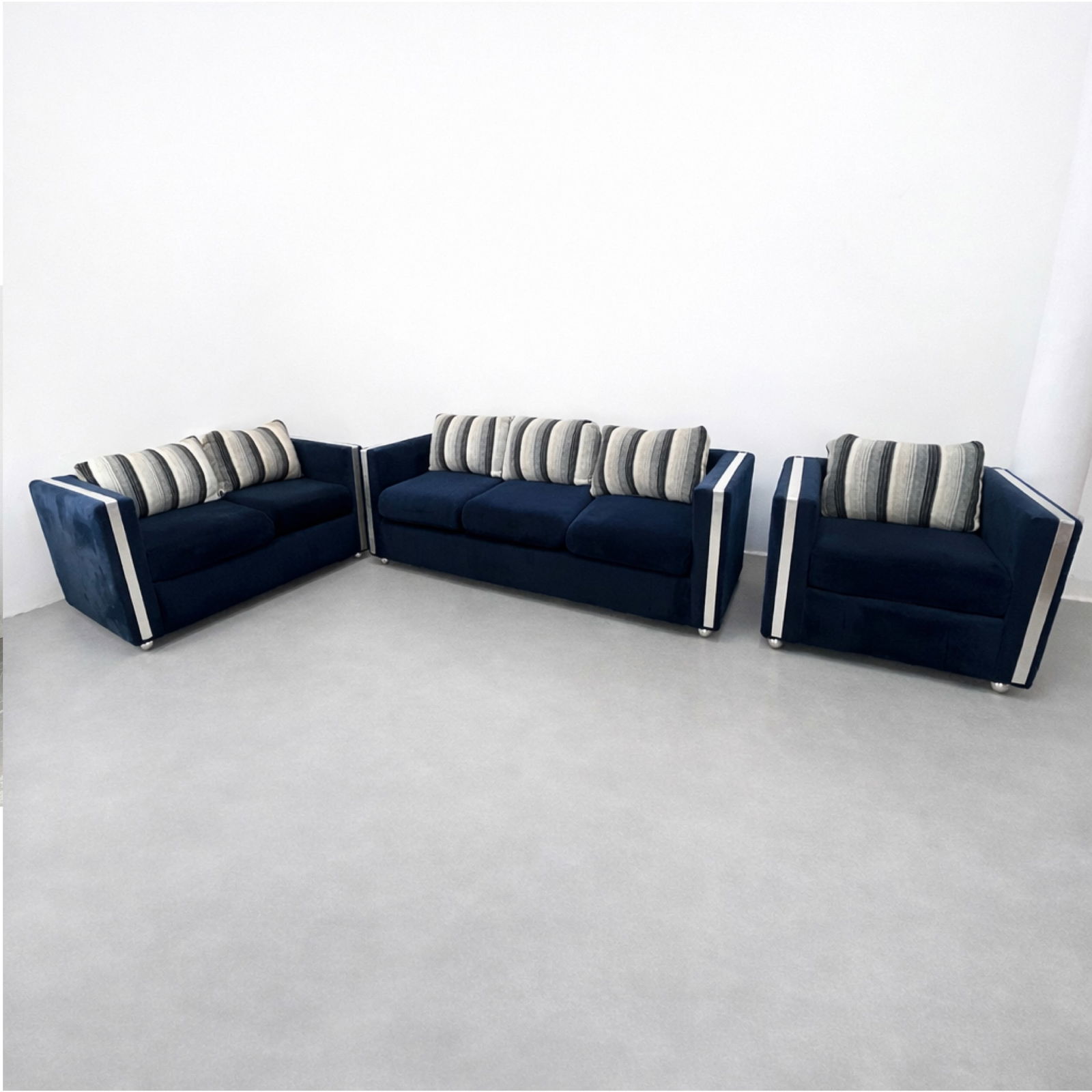 3pc Mid Century Modern Seating. Sofa, Love Seat and Cube Lounge Chair. Blue Plush Upholstery with Wh: 3pc Mid Century Modern Seating. Sofa, Love Seat and Cube Lounge Chair. Blue Plush Upholstery with White Stripe Trim Details. All have Cube Square form Frames. on Casters. STUART FURNITURE Label. Dimen