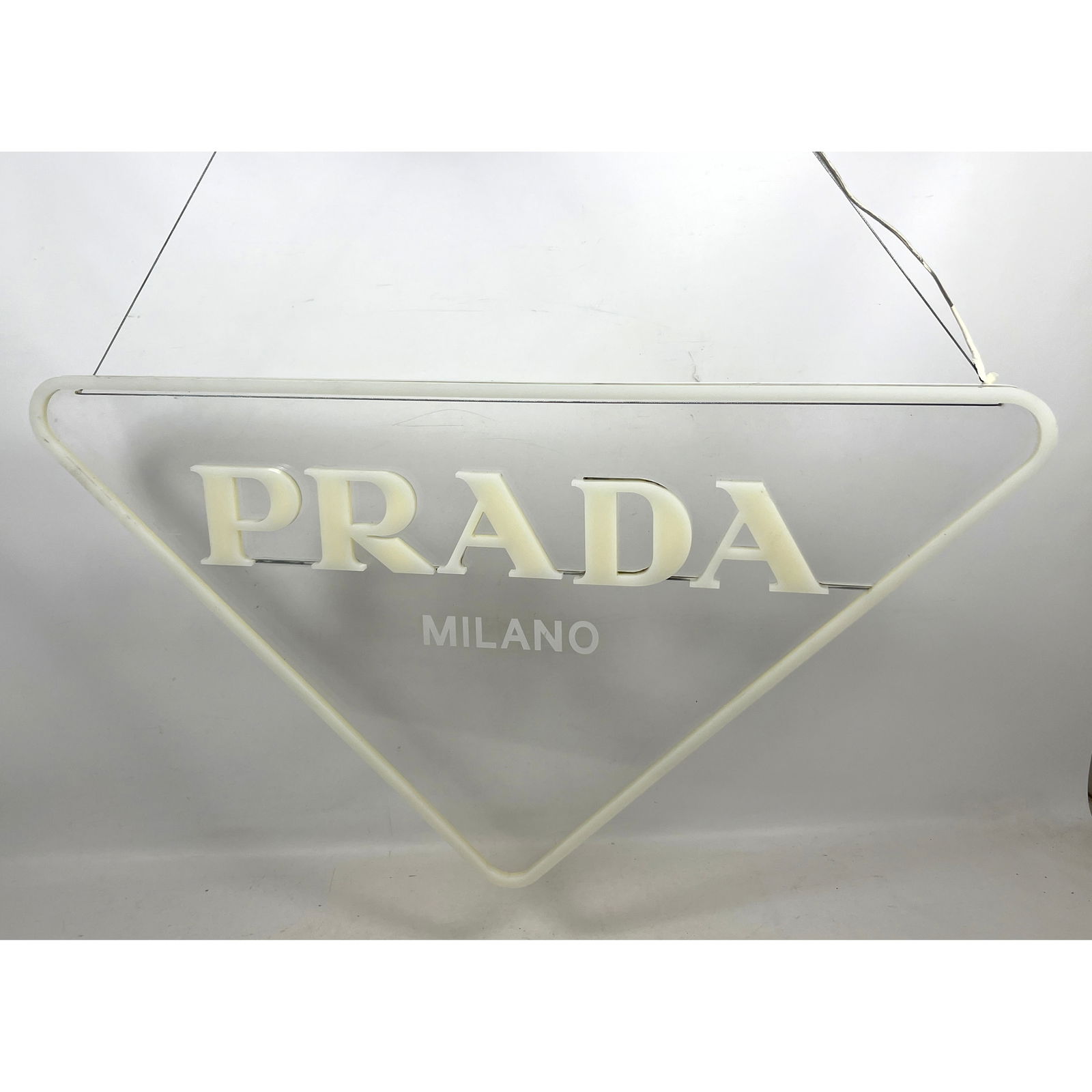 PRADA Milano Advertising Sign. Acrylic Logo Sign. LED Lights not working.: PRADA Milano Advertising Sign. Acrylic Logo Sign. LED Lights not working. Dimensions: Height: 20 inches, Width: 36 inches. ---