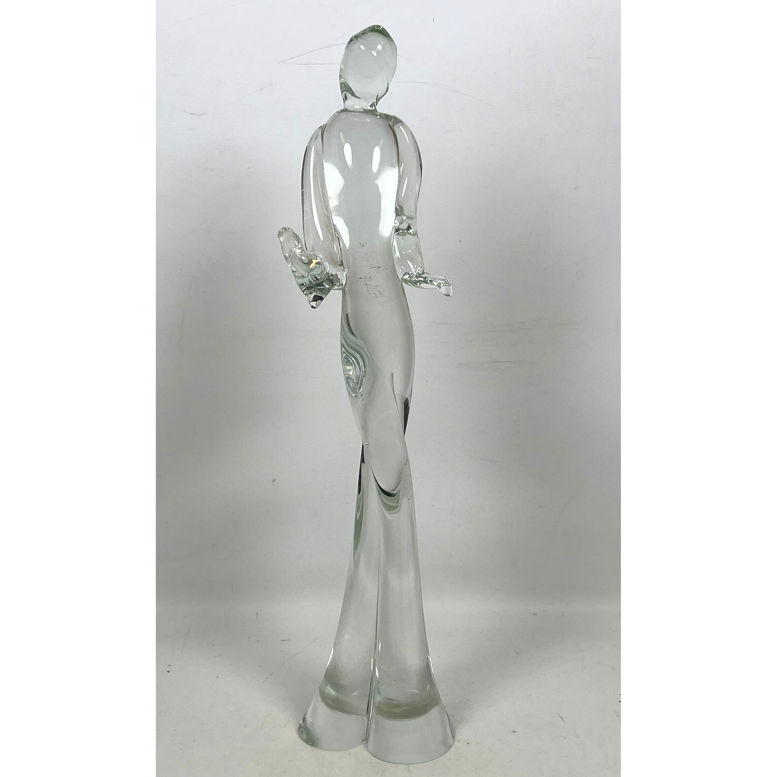 Elongated Clear Glass Figural Sculpture. Illegibly Signed.: Elongated Clear Glass Figural Sculpture. Illegibly Signed. Dimensions: Height: 22.5 inches, Width: 5 inches, Depth: 3 inches. ---