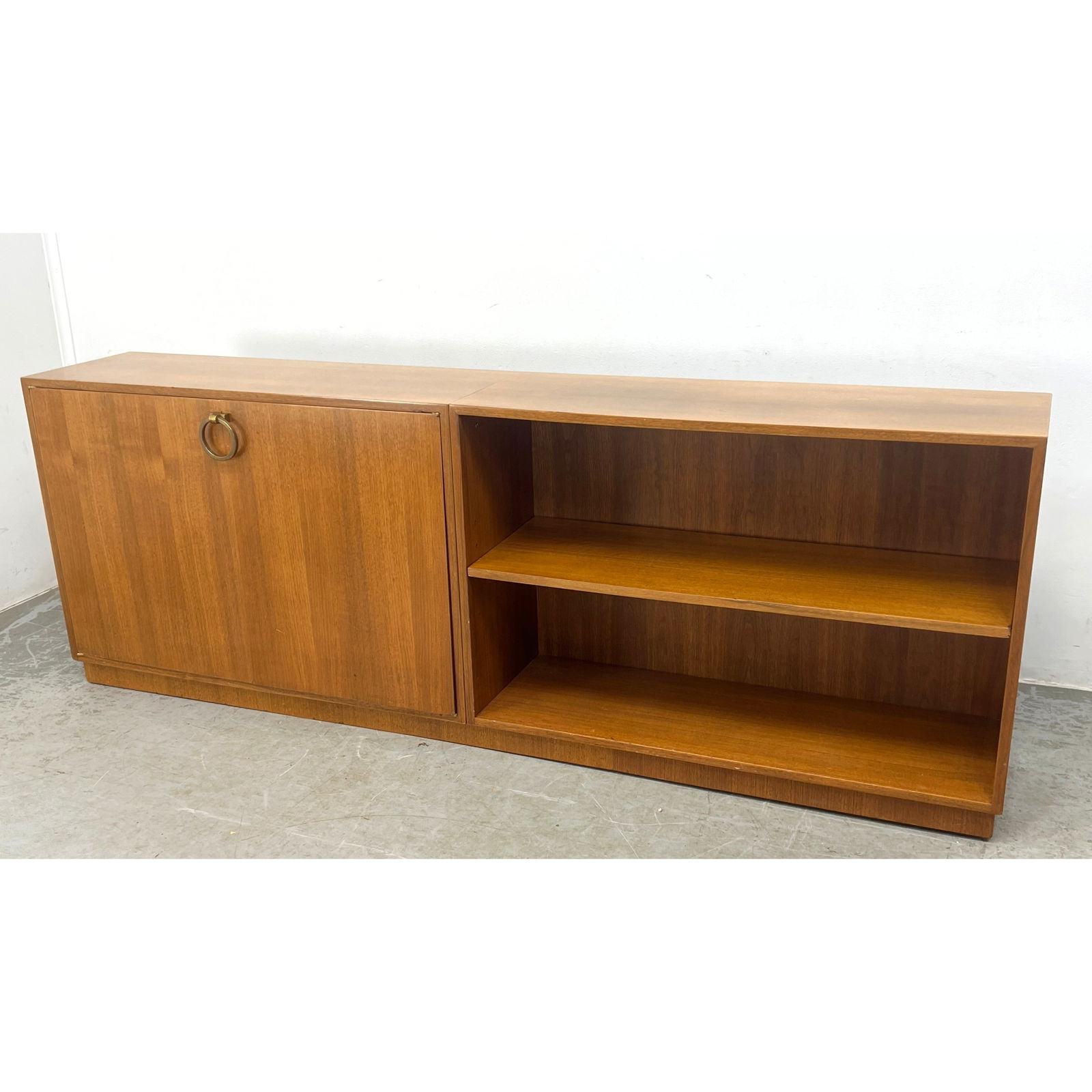 Mid Century Modern Art Deco Style Bookcase Cabinet. Gilbert Rohde style ring handle.: Mid Century Modern Art Deco Style Bookcase Cabinet. Gilbert Rohde style ring handle. Dimensions: Height: 30 inches, Width: 84.5 inches, Depth: 15.5 inches. ---