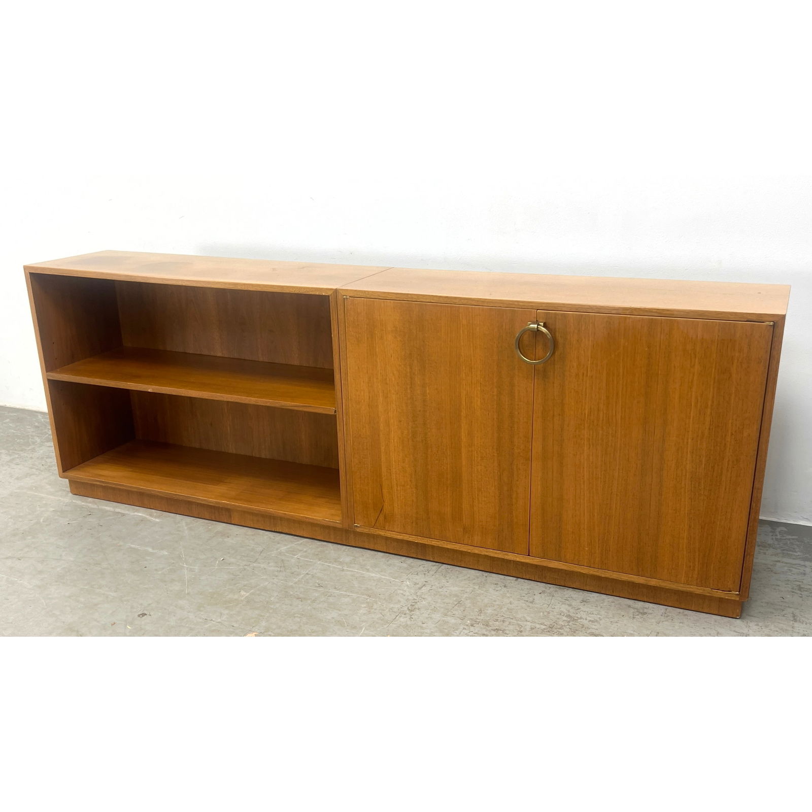 Mid Century Modern Art Deco Style Bookcase Cabinet. Gilbert Rohde style ring handle.: Mid Century Modern Art Deco Style Bookcase Cabinet. Gilbert Rohde style ring handle. Dimensions: Height: 30 inches, Width: 84.5 inches, Depth: 15.5 inches. ---