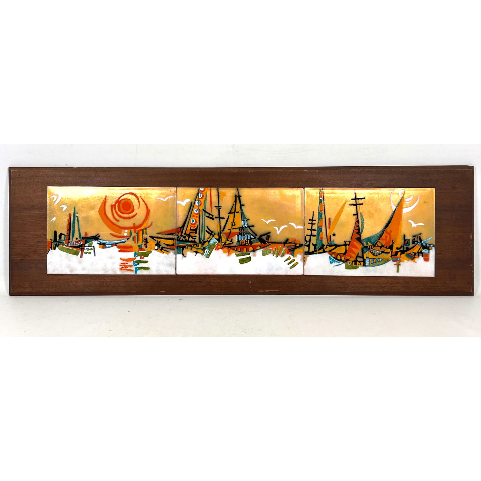 Enameled triptych of Harbor Scene and Sailboats. Mounted on Dark Wood Plaque. MCM. No signature or m: Enameled triptych of Harbor Scene and Sailboats. Mounted on Dark Wood Plaque. MCM. No signature or marks. Dimensions: Height: 11 inches, Width: 40 inches. ---