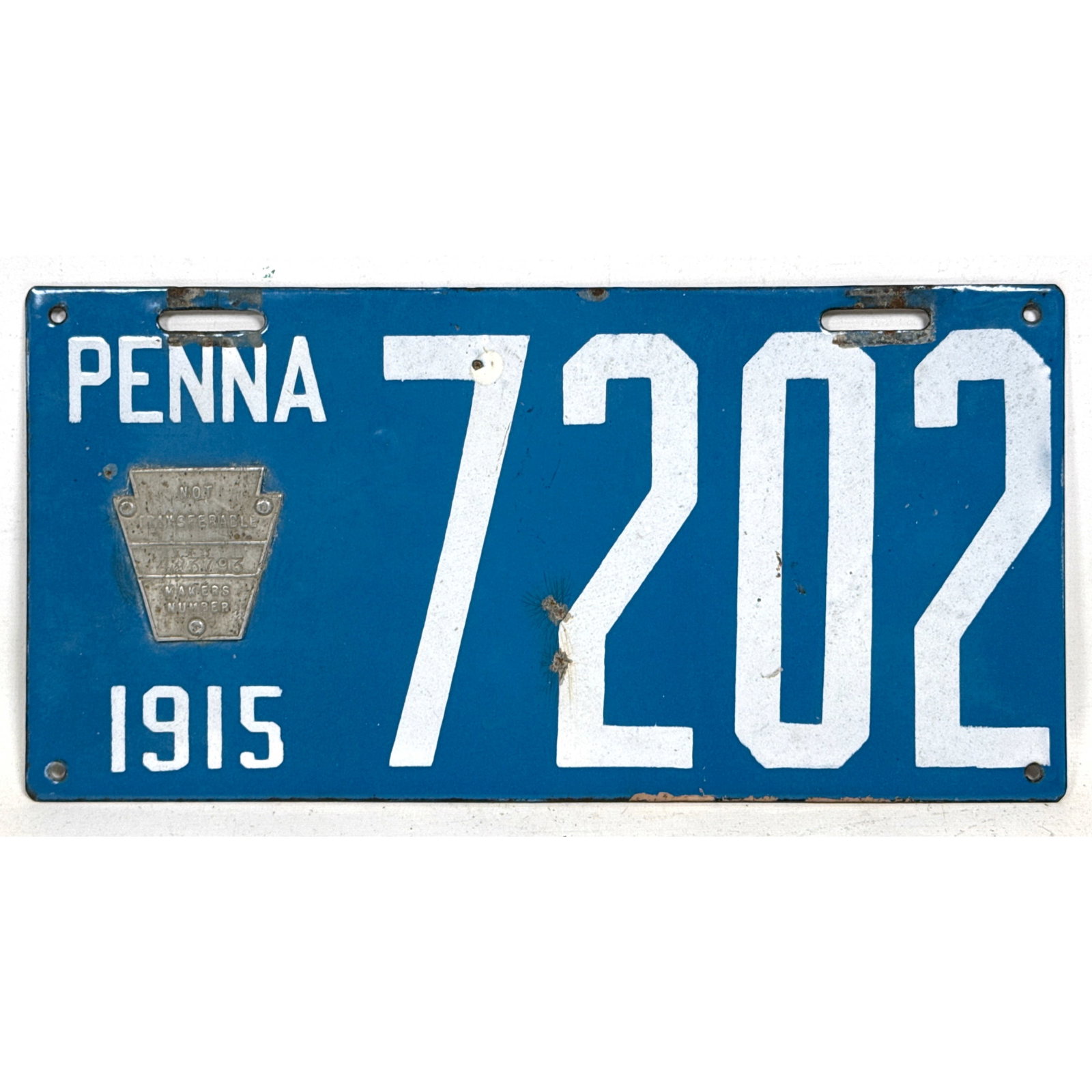 1915 Early Pennsylvania Auto License Plate. Applied Metal Keystone Plaque. Produced by Brilliant Mfg: 1915 Early Pennsylvania Auto License Plate. Applied Metal Keystone Plaque. Produced by Brilliant Mfg. Co. Dimensions: Height: 6 inches, Width: 12 inches, Depth: .1 inches. ---