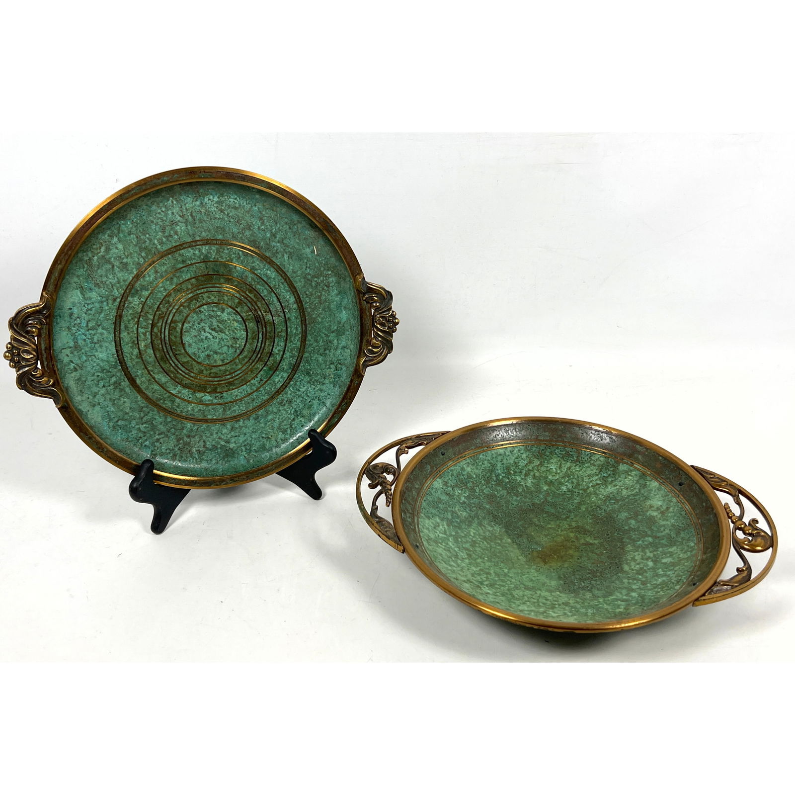 2pc CARL SORENSEN MCM Bronze Tableware. Large Charger and Handled Bowl. Rich Green Patina. Marked.: 2pc CARL SORENSEN MCM Bronze Tableware. Large Charger and Handled Bowl. Rich Green Patina. Marked. Dimensions: Height: 3 inches, Width: 14.5 inches, Depth: 11 inches. ---