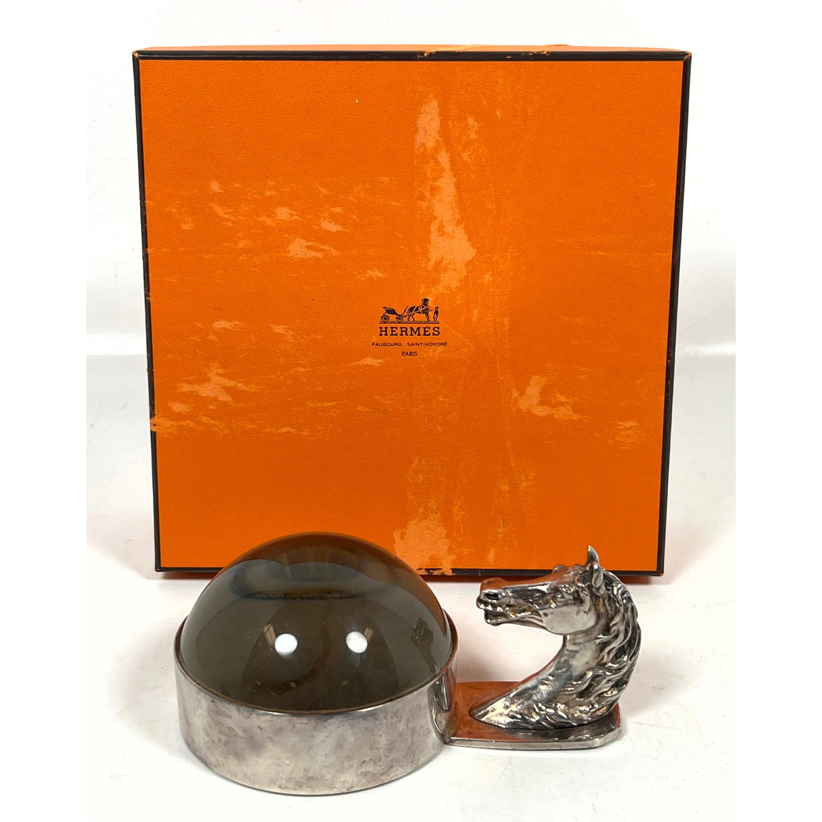 HERMES Paris Silver Plate Horse Head Magnifier. Paperweight. Figural Horse Head Magnifying Desk Top: HERMES Paris Silver Plate Horse Head Magnifier. Paperweight. Figural Horse Head Magnifying Desk Top Loupe. Comes in Hermes Box. Marked. Dimensions: Height: 2.75 inches, Width: 3.5 inches, Depth: 5.5 i