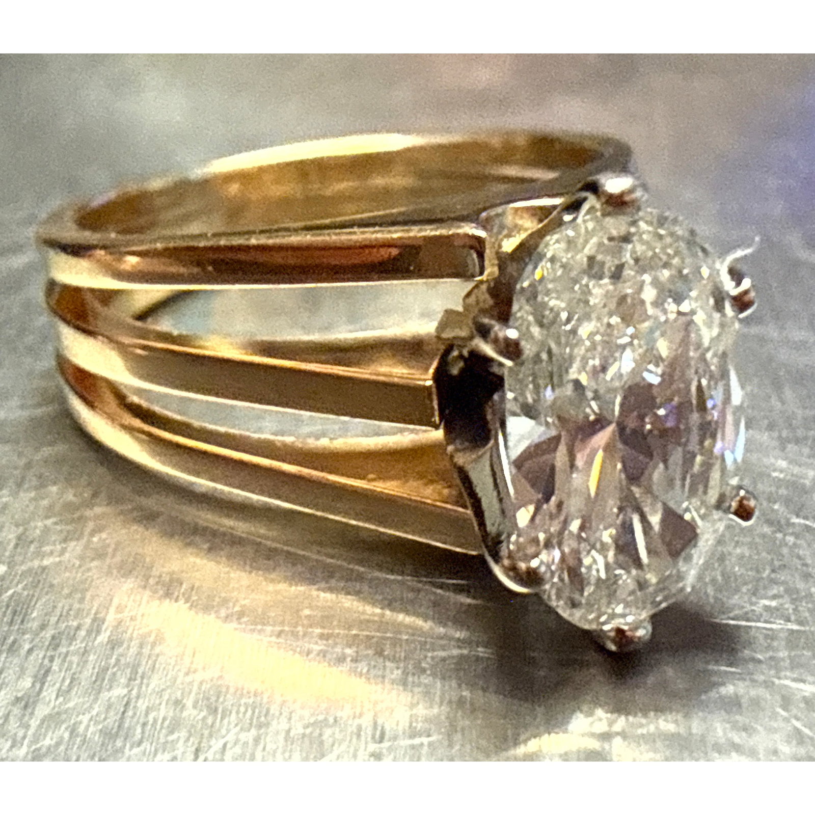 1.97 CT Oval Diamond Ring set 14K yellow Gold. Size 7. Includes scan of original 1985 appraisal.: 1.97 CT Oval Diamond Ring set 14K yellow Gold. Size 7. Includes scan of original 1985 appraisal. Dimensions: Height: .5 inches, Width: .75 inches, Depth: .75 inches. Weight: 4.5 DWT ---