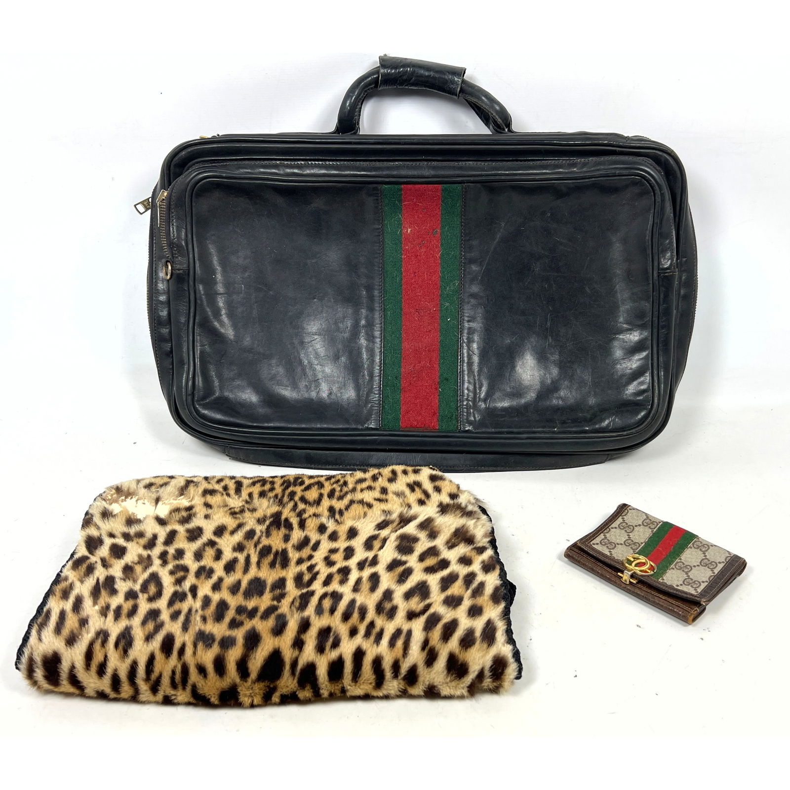3pc vintage fashion Accessories. GUCCI Black Leather soft side Attache Case Briefcase. GUCCI Logo Wa: 3pc vintage fashion Accessories. GUCCI Black Leather soft side Attache Case Briefcase. GUCCI Logo Wallet. Faux Leopard Hand Warmer. Dimensions: Height: 18 inches, Width: 24 inches, Depth: 4 inches. --
