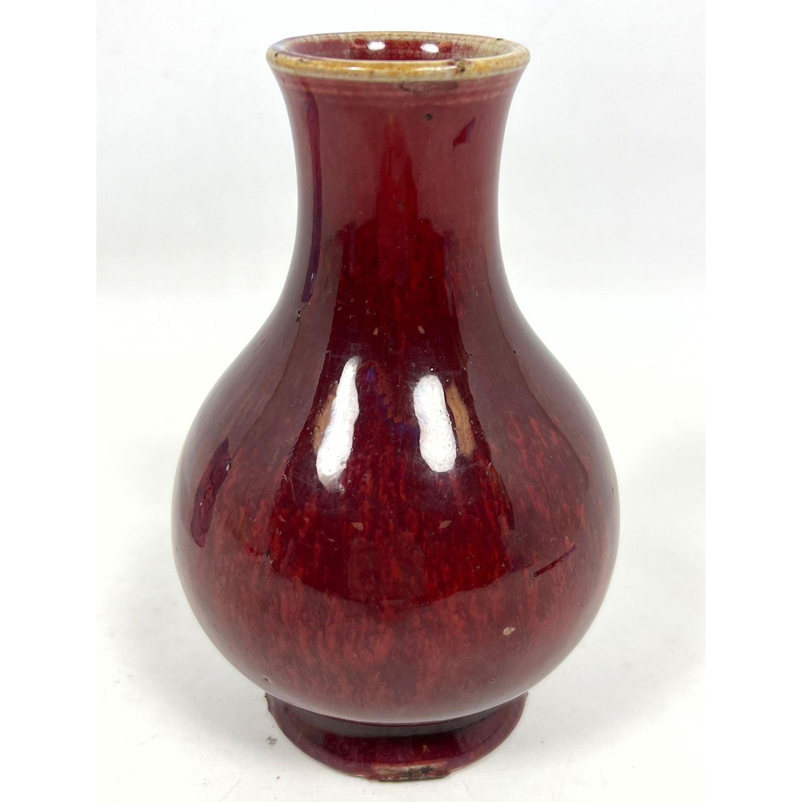 Asian Porcelain Vase in mottled oxblood or sang de boeuf glaze. (1 of 9)