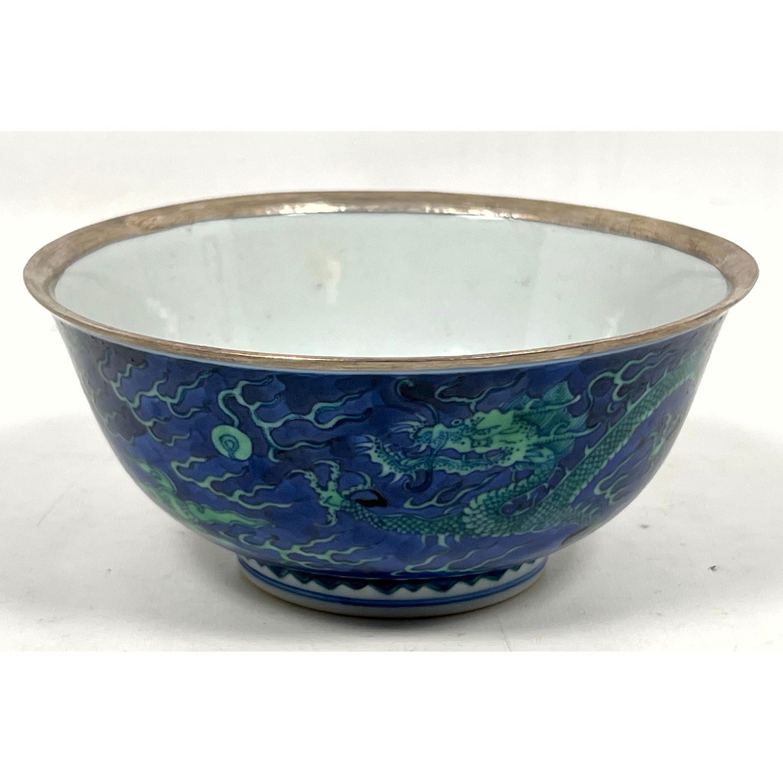 Chinese porcelain bowl featuring a deep blue ground decorated with green and light blue imperial dra (1 of 10)