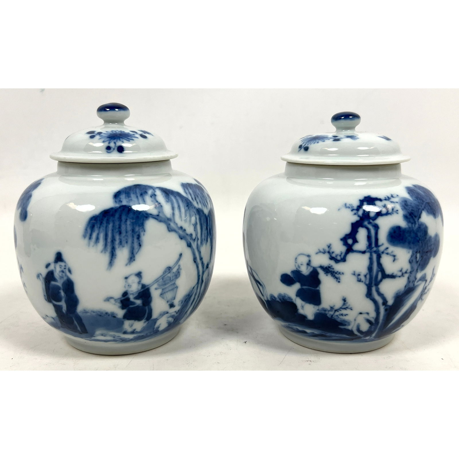 Pair of Chinese blue and white porcelain ginger jars featuring a squat, rounded form with matching d (1 of 13)