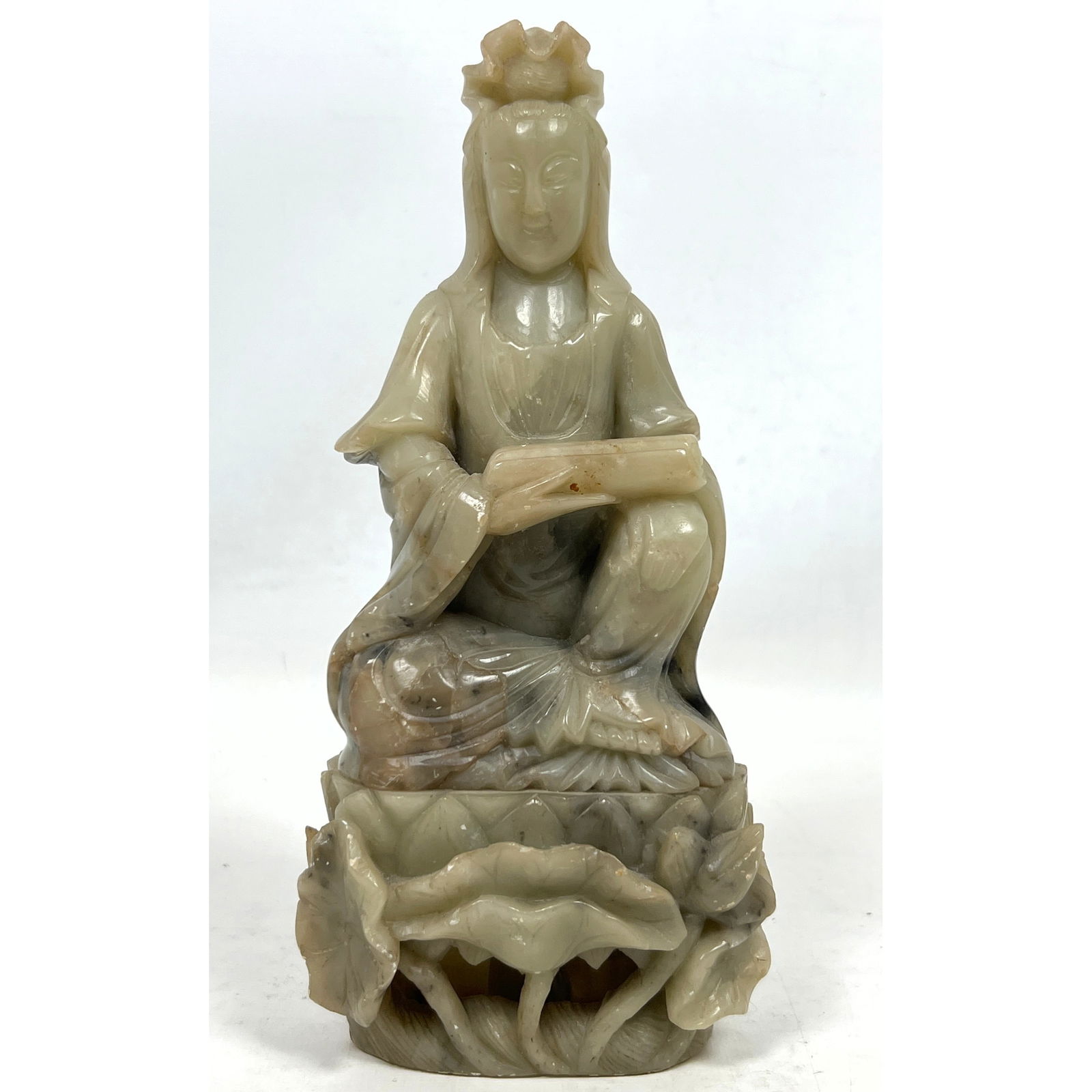 Carved Stone Asian Figure, Possibly Guanyin. Seated Figure above Lotus.: Carved Stone Asian Figure, Possibly Guanyin. Seated Figure above Lotus. Dimensions: Height: 9 inches, Width: 4.25 inches, Depth: 3 inches. ---