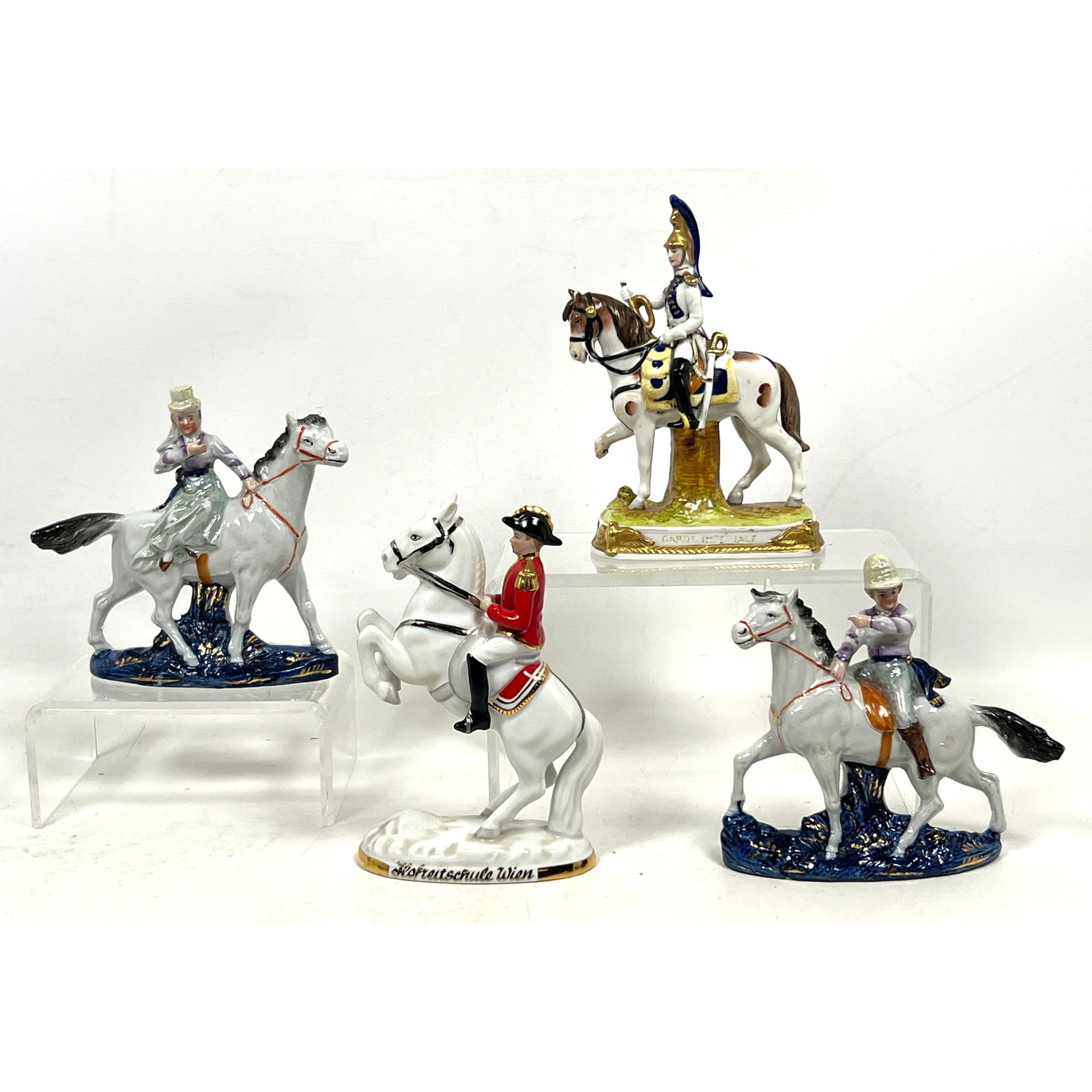4pcs Polychrome glazed porcelain figurines. Imperial figures on horseback.: 4pcs Polychrome glazed porcelain figurines. Imperial figures on horseback. Dimensions: Height: 7 inches, Width: 4.25 inches, Depth: 2 inches. ---