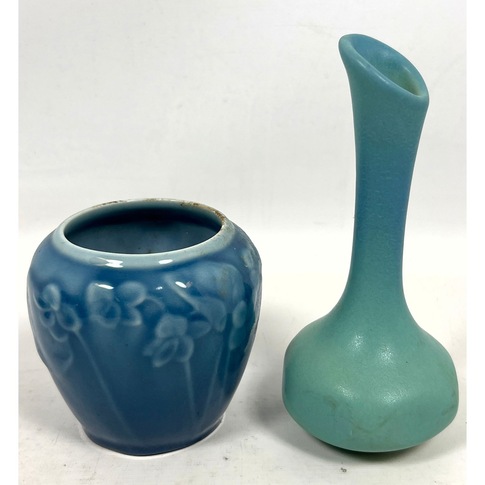 2pc American Art Pottery Vases. ROOKWOOD Small Vase with Viola Pattern. Marked, Dated; #6432. VAN BR: 2pc American Art Pottery Vases. ROOKWOOD Small Vase with Viola Pattern. Marked, Dated; #6432. VAN BRIGGLE Turquoise Glazed Bud Vase. Marked. Dimensions: Height: 7 inches, Width: 4.25 inches. ---