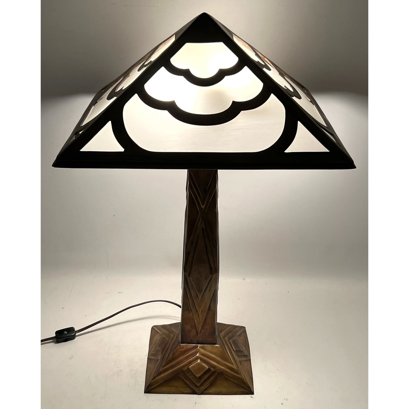 Art Deco Style Pressed Metal Table Lamp. Plastic shade inserts.: Art Deco Style Pressed Metal Table Lamp. Plastic shade inserts. Dimensions: Height: 23 inches, Width: 14 inches, Depth: 14 inches. ---