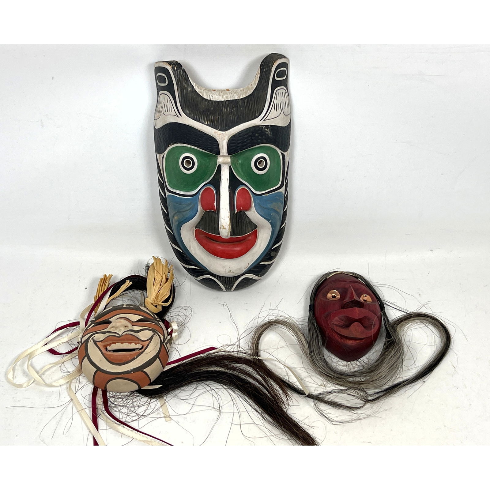 3pc Native American Masks. Carved Painted Wood and Pottery. JESSE DAVID 1990 Carved Wood Polychrome: 3pc Native American Masks. Carved Painted Wood and Pottery. JESSE DAVID 1990 Carved Wood Polychrome Painted Mask. Northwest Coast. 2) FANNIE LORETTO Pottery Child's Guardian Mask. Jemez Pueblo. 3) Sma