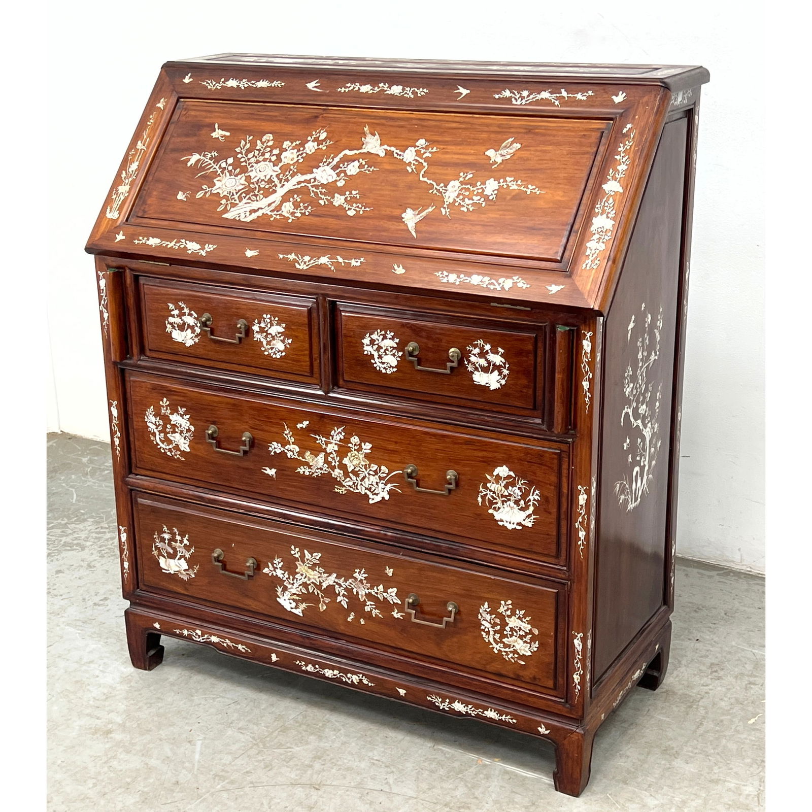 Chinese Export rosewood slant-front desk featuring extensive mother-of-pearl inlays.: Chinese Export rosewood slant-front desk featuring extensive mother-of-pearl inlays. Dimensions: Height: 42 inches, Width: 36 inches, Depth: 17 inches. ---