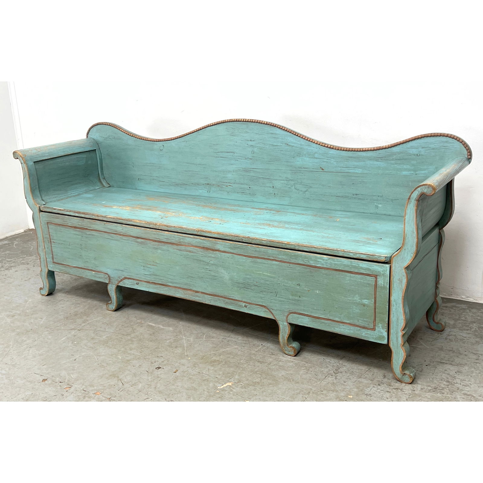 Swedish farmhouse folk art settle bench is constructed from pine and features a high, triple-arched: Swedish farmhouse folk art settle bench is constructed from pine and features a high, triple-arched backrest accented by a beaded top edge. Lift out seat. Dimensions: Height: 33.5 inches, Width: 79.5