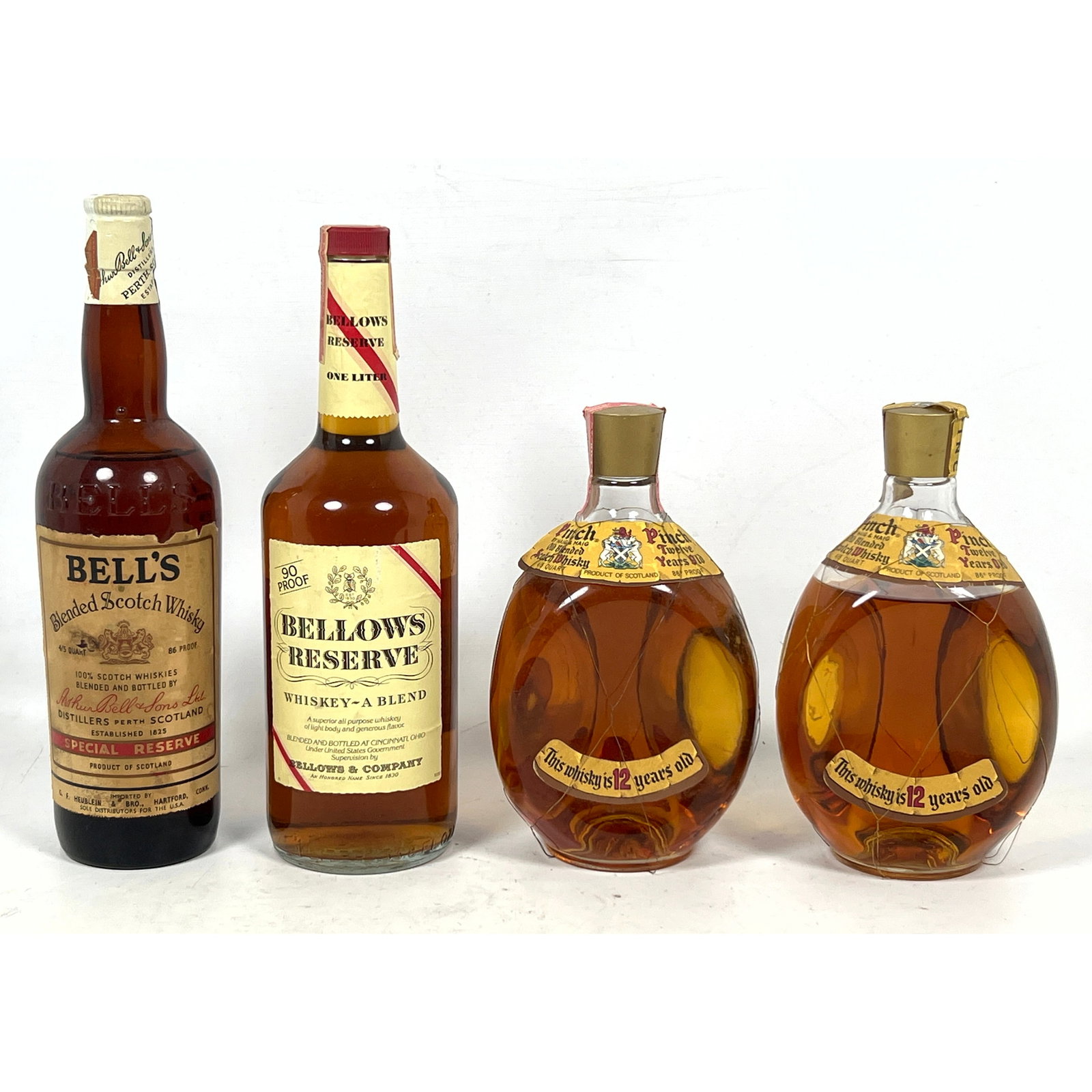 4pcs Whiskey. Bell's Scotch Whisky, Bellows Reserve, 2 Pinch.: 4pcs Whiskey. Bell's Scotch Whisky, Bellows Reserve, 2 Pinch. Dimensions: Height: 12 inches, Width: 3 inches, Depth: 3 inches. ---