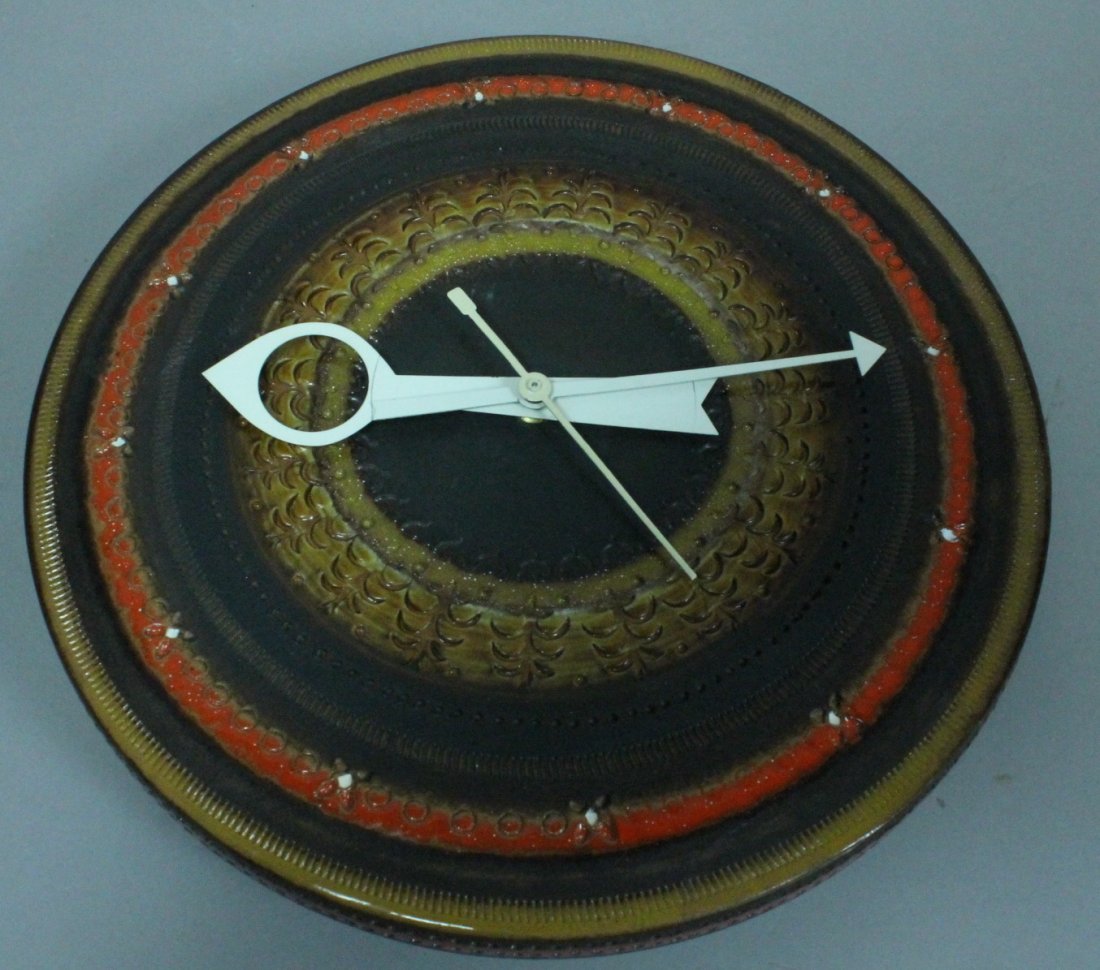 GEORGE NELSON Meridian Wall Clock. RAYMOR Italian: GEORGE NELSON Meridian Wall Clock. RAYMOR Italian Round Ceramic Clock. Brown & Orange Palette. Marked Italy. -- Dimensions: H: 14 inches: W: 3 inches ---