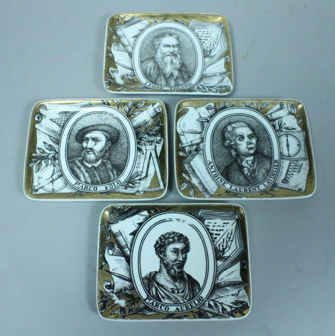Set 4 PIERO FORNASETTI Dishes Plates. Marco Polo,: Set 4 PIERO FORNASETTI Dishes Plates. Marco Polo, Marcus Aurelius, Tolstoy, Lavoisier. Great men of Science, Literature, etc. Black & White Graphics with Gold Details. Leone Tolstoi. Antoine Laurent L