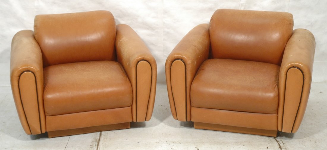 Pr Directional Leather Club Lounge Chairs: Pr Leather Club Lounge Chairs. Brown Leather with Black leather piping trim. -- Dimensions: H: 29 inches: W: 38 inches: D: 35 inches ---