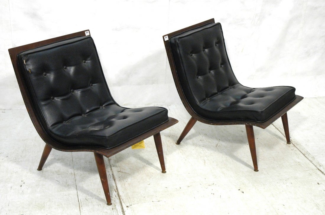 Pr Black Tufted Sling Seat Lounge Chairs. Peg Leg: Pr Black Tufted Sling Seat Lounge Chairs. Peg Legs. Molded wood frames.-- Dimensions: H: 29 inches: W: 23 inches: D: 27.5 inches ---