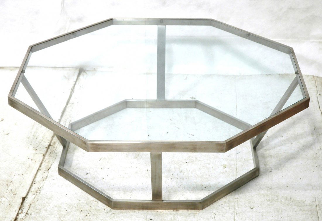 Octagonal Chrome & Glass Cocktail Coffee Table. T: Octagonal Chrome & Glass Cocktail Coffee Table. Thick wide chrome frame with inset glass. -- Dimensions: H: 15.5 inches: W: 43 inches: D: 43 inches ---