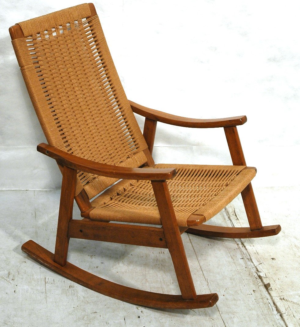 Hans Wegner style Woven Rush Rocker Rocking Chair: Hans Wegner style Woven Rush Rocker Rocking Chair. Wood frame with woven seat & back. Marked: Yugoslavia. -- Dimensions: H: 36 inches: W: 25 inches: D: 33 inches ---