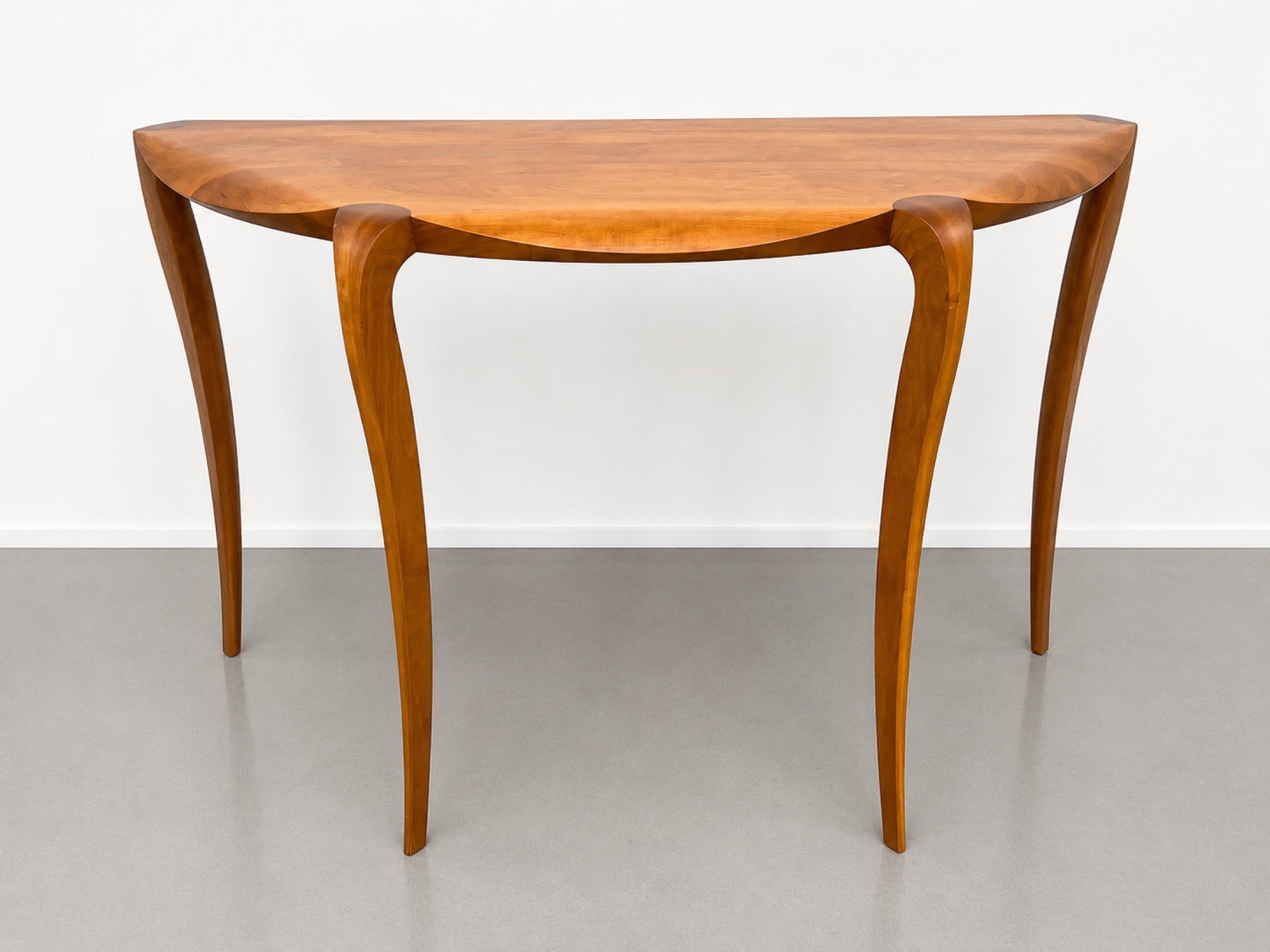 Thomas Moser 2014 Demilune Console Table. Cabinetmakers of Auburn, Maine. Elegant leg design.: Thomas Moser 2014 Demilune Console Table. Cabinetmakers of Auburn, Maine. Elegant leg design. Dimensions: Height: 28 inches, Width: 47 inches, Depth: 19 inches. ---