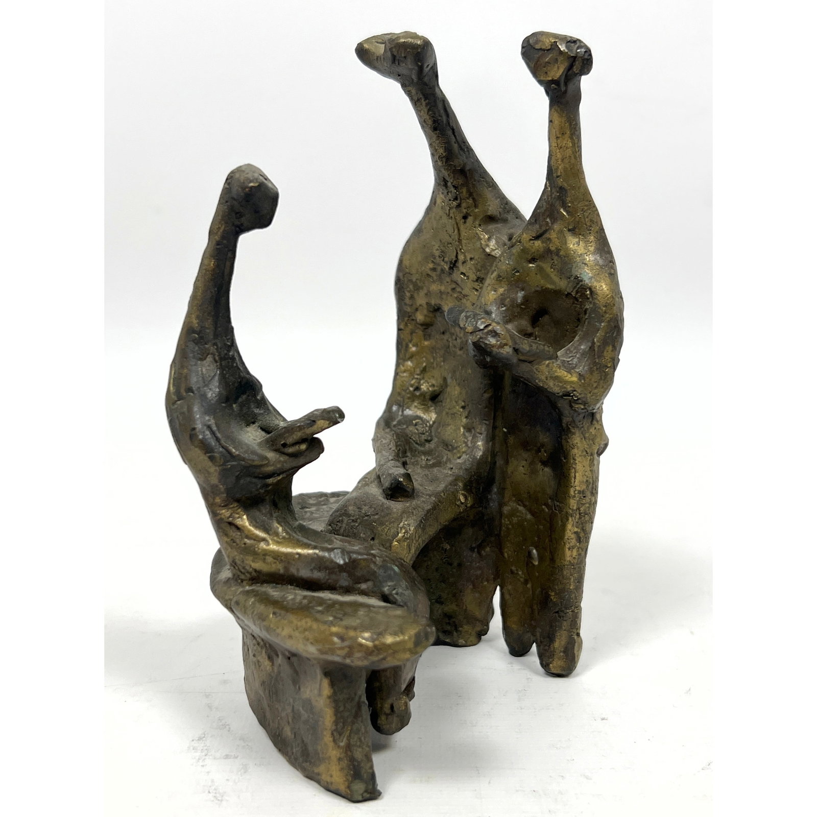 MCM Bronze Figural Group Sculpture. Three figures. Two are seated reading books. No signature found.: MCM Bronze Figural Group Sculpture. Three figures. Two are seated reading books. No signature found. in style of Aaron Bezalel. Dimensions: Height: 6 inches, Width: 2.75 inches, Depth: 2.5 inches.