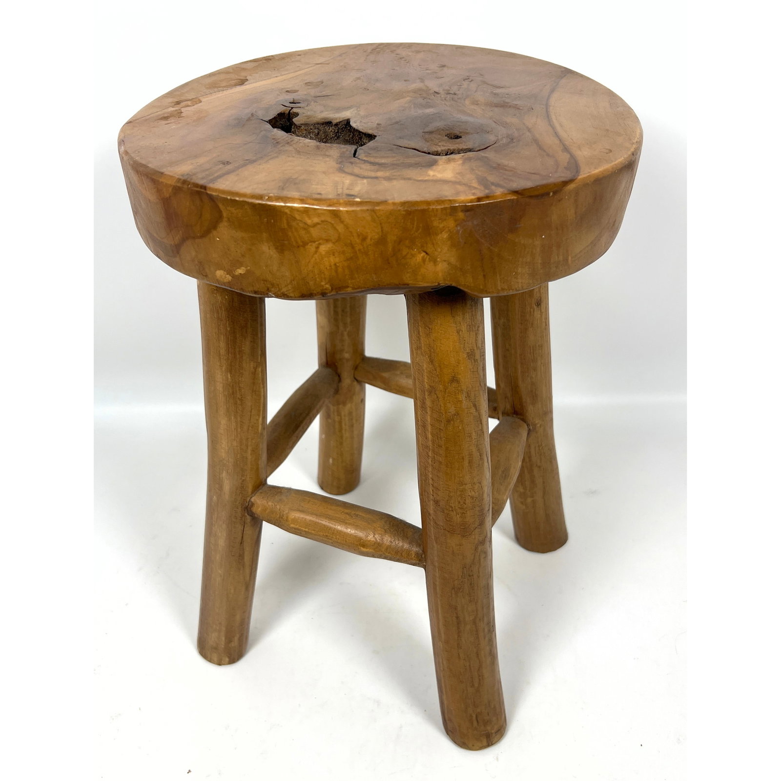 Rustic four-legged stool is constructed from solid teak wood.: Rustic four-legged stool is constructed from solid teak wood. Dimensions: Height: 15.5 inches, Width: 11.5 inches, Depth: 11.5 inches. --- US Packing and Shipping charge: In house shipping available.