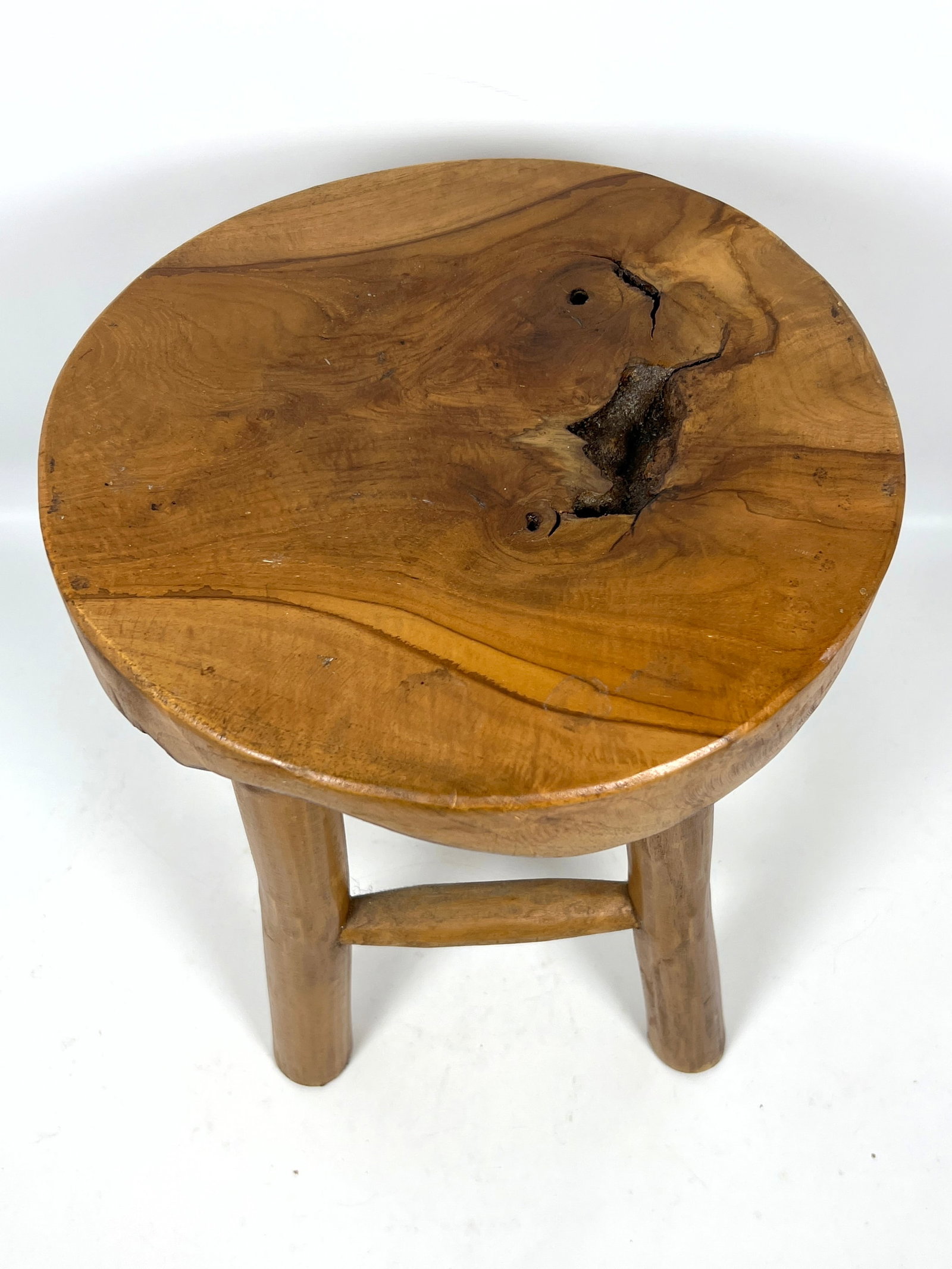 Rustic four-legged stool is constructed from solid teak wood. - 2