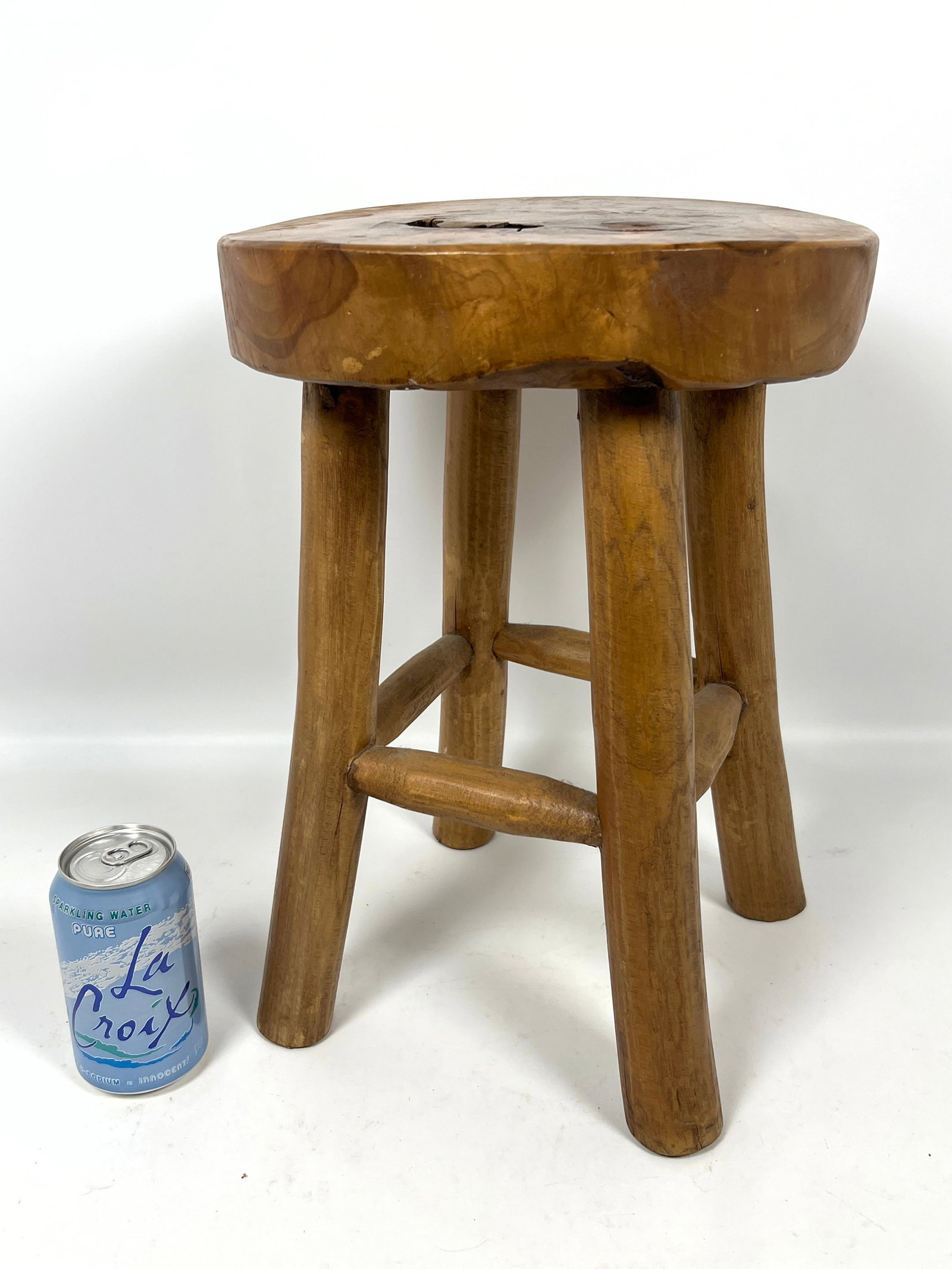 Rustic four-legged stool is constructed from solid teak wood. - 3